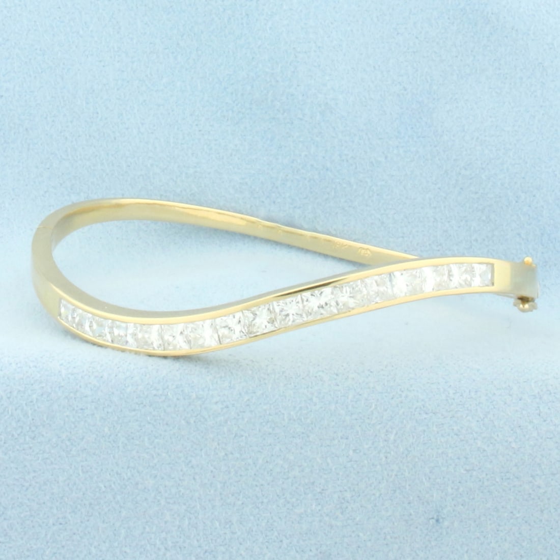 Princess Diamond Wave Design Bangle Bracelet in 18k Yellow Gold: In 18k yellow gold. Contains seventeen high quality princess cut diamonds, 4ct TW, VS clarity/G color, great cut for extra brilliance. Interior dimensions 2 1/4 inches by 2 inches. Hinged design, doub
