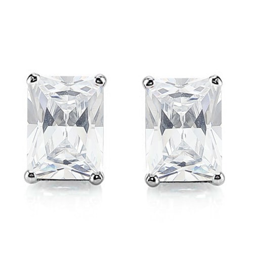 5x7 Emerald Cut White Topaz Earrings in Sterling Silver: In platinum over .925 sterling silver basket mountings with friction backs included. Contains 2 emerald cut White Topaz gemstones with excellent color and clarity, approx. 2.5CTW, 5x7mm each. 1.5g