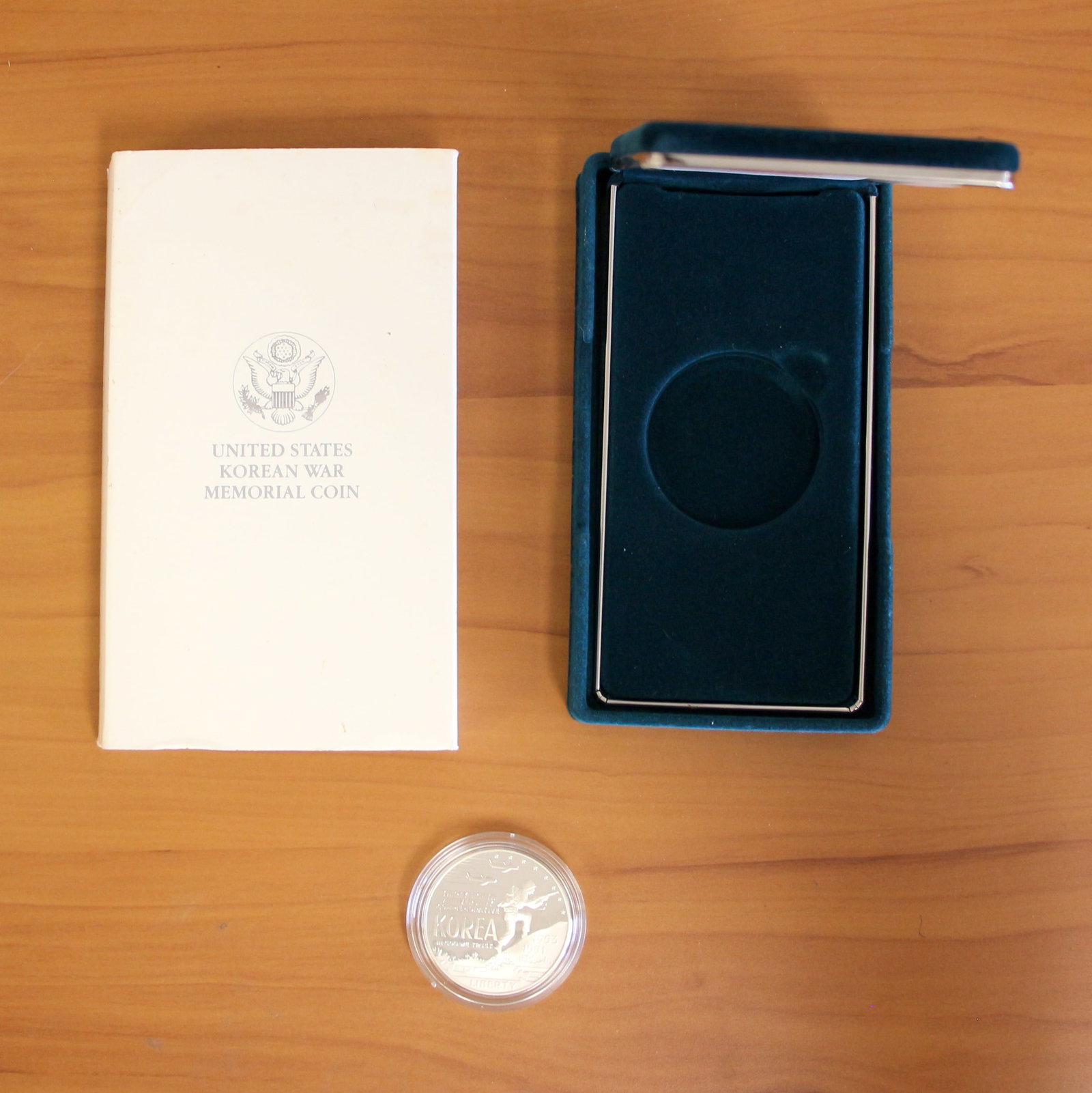 US Mint 38th Anniversary Korean War Memorial Silver Coin OGP: Contains one 38th Anniversary Korean War $1 Silver Memorial Coin. Includes original packaging.