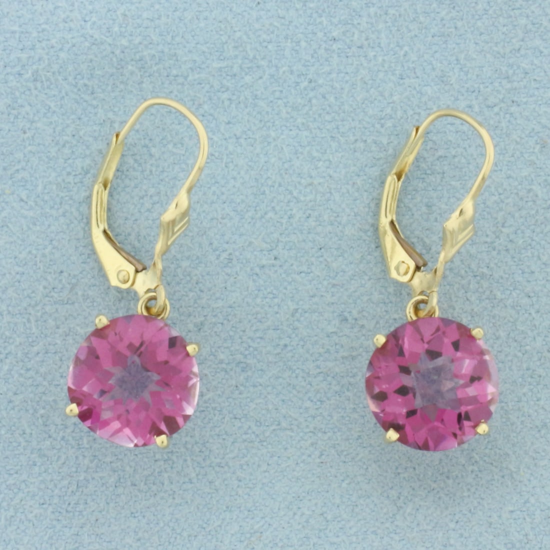 Checkerboard Cut Pink Topaz Dangle Earrings in 14k Yellow Gold: In 14k Yellow Gold. Contains two 10mm high quality fancy checkerboard cut natural Pink Topaz gemstones, approximately 7ct TW, with intense color and excellent clarity. 1 inch long. 10mm wide. Leverbac