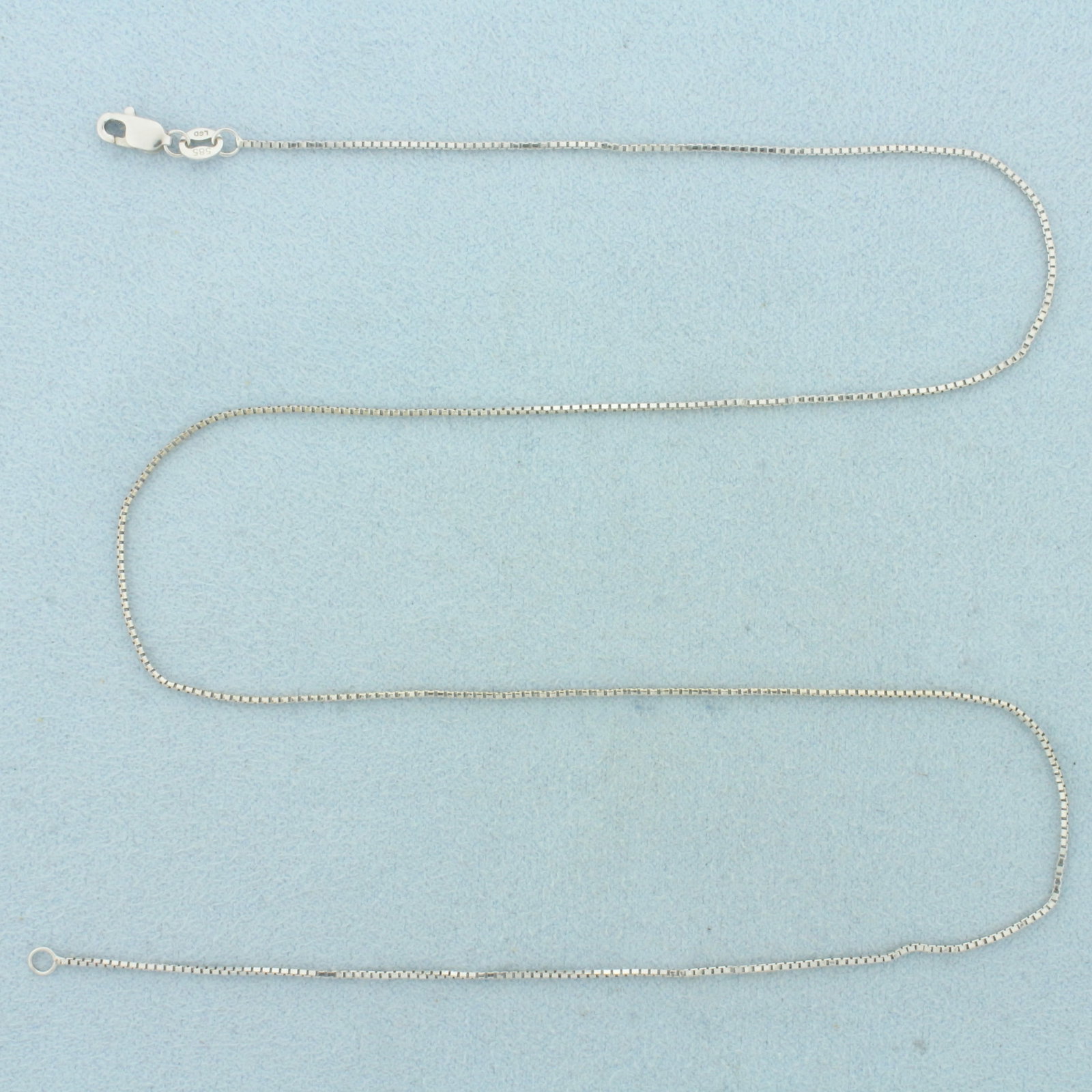 17 Inch Box Link Chain Necklace in 14k White Gold: In 14k White Gold. 17 inches long. 0.8mm wide. Lobster clasp. 1.9g.