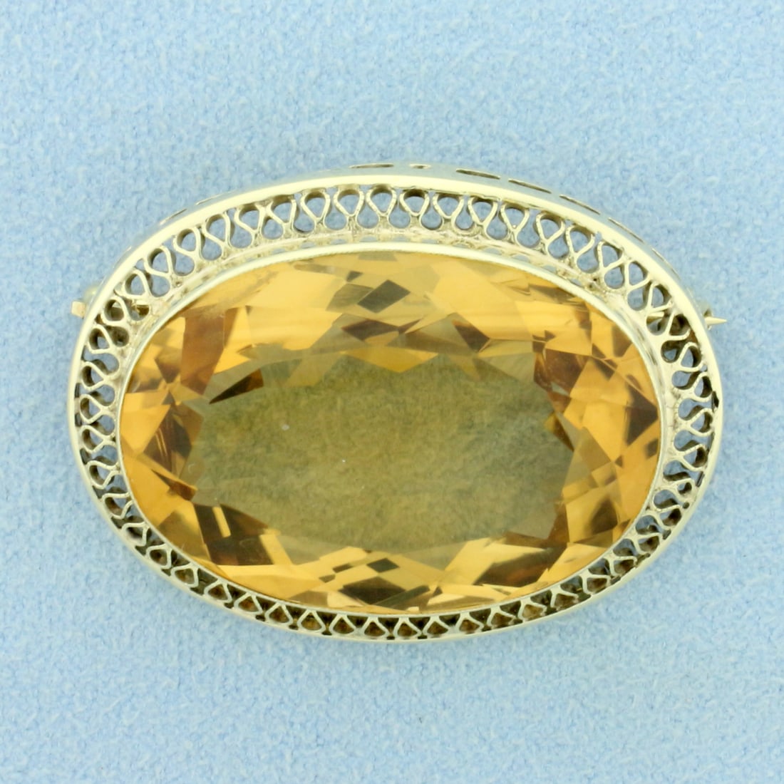 Vintage Citrine Statement Pin in 14K Yellow Gold: In 14K Yellow Gold. Contains one high quality natural 30x20mm 35ct oval Citrine gemstone with bright color and excellent clarity. 1 inch long, 1 1/2 inches wide. 13.0g.