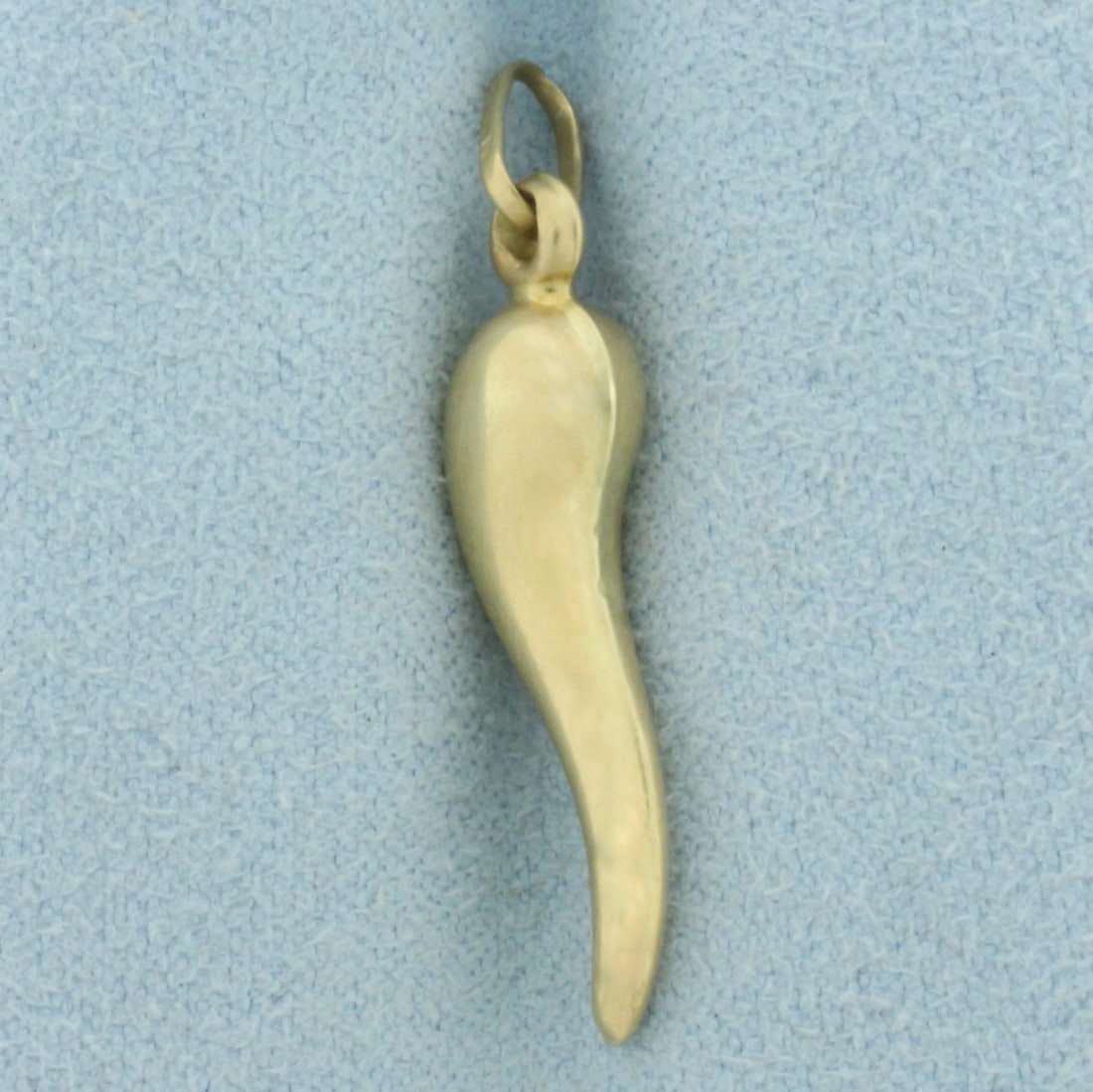 Italian Horn Pendant or Charm in 14k Yellow Gold: In 14k Yellow Gold. 1 inch long. 1/4 inch wide. 1.3g.