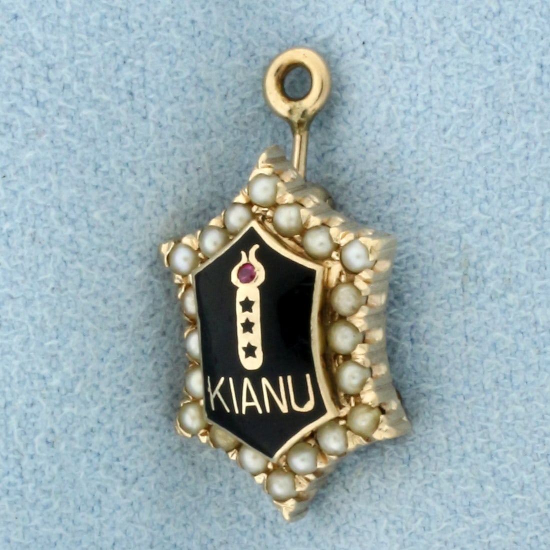 Vintage Kianu Chi Alpha Nu XAN Charm or Pendant in 10k Yellow Gold: In 10k Yellow Gold. Contains one 1mm ruby with intense color. Also contains twenty high quality seed pearls with high luster. 7/8 inch long including bale. 1/2 inch wide. Chapter is at Muskingum Colle