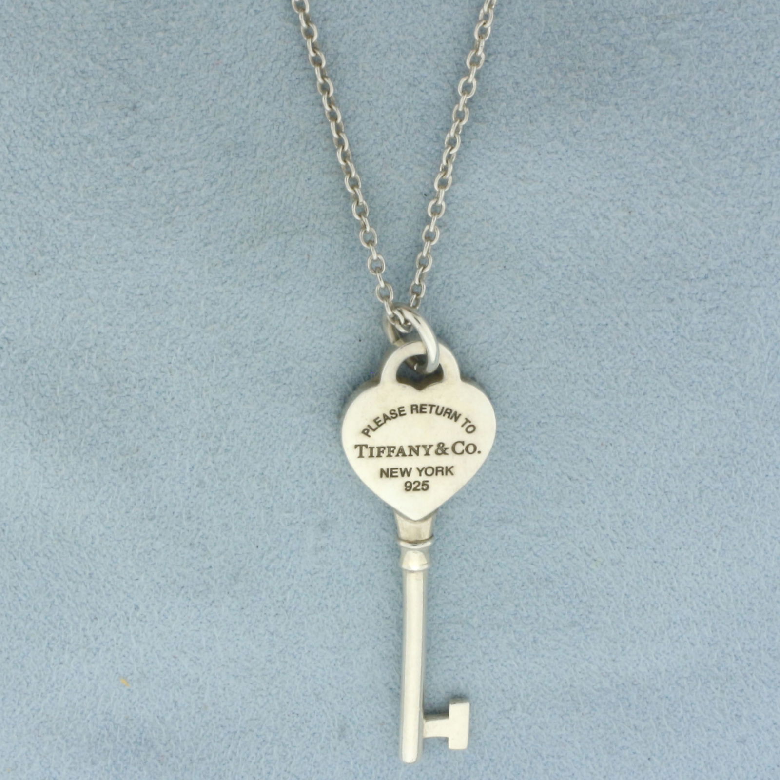 Tiffany & Co. Return To Tiffany Heart Key Necklace In Sterling Silver: In .925 sterling silver. Guaranteed Authentic. Chain is 24.5" long, spring clasp, 1.4mm wide. Pendant is 1 5/8" long and 0.5" wide. 6.6g.