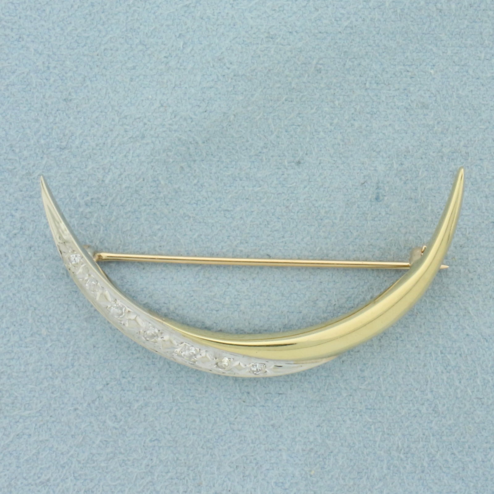 Vintage Diamond Crescent Moon Brooch Pin in 14k Yellow and White Gold: In 14k Yellow and White Gold. Contains seven high quality diamonds, 1/10ct TW, VS clarity/H color. 1 5/8 inch long. 7/8 inch wide. 3.5g.