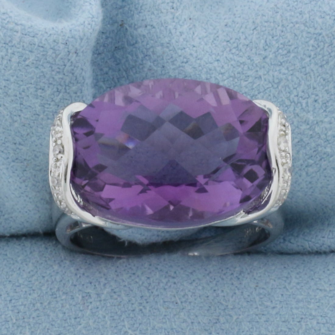 Checkerboard Cut Amethyst and Diamond Statement Ring in 14k White Gold: In 14k white gold. Contains one 19x13mm high quality natural fancy checkerboard cut Amethyst Gemstone with vibrant color and excellent clarity. Also contains ten high quality 1/2pt diamonds. Size 7. 6