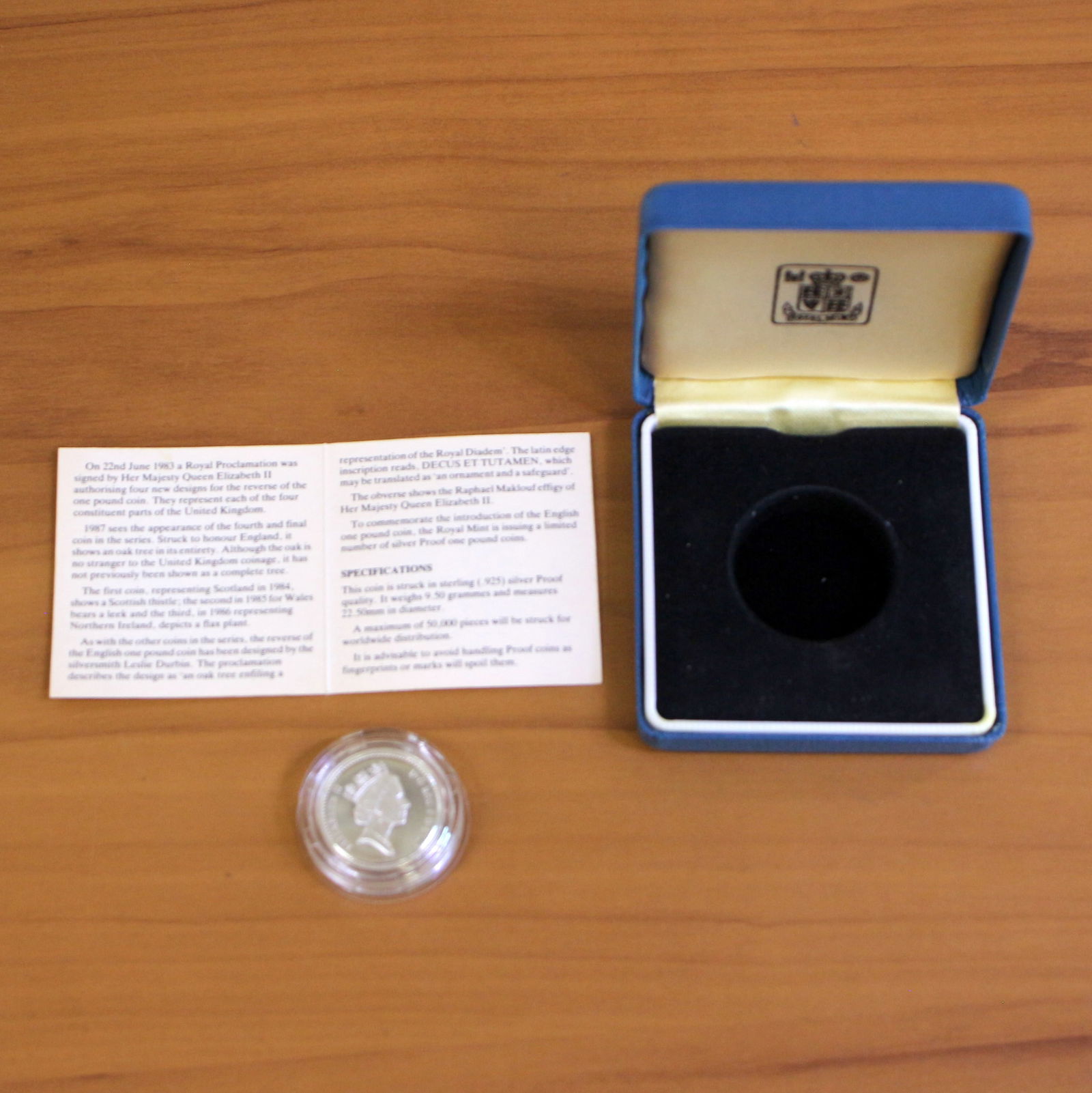1987 United Kingdom Royal Mint Silver One Pound Proof Coin OGP: Contains one 1987 United Kingdom Royal Mint .925 Sterling Silver One Pound Coin. Set in original packaging and contains certificate of authenticity.