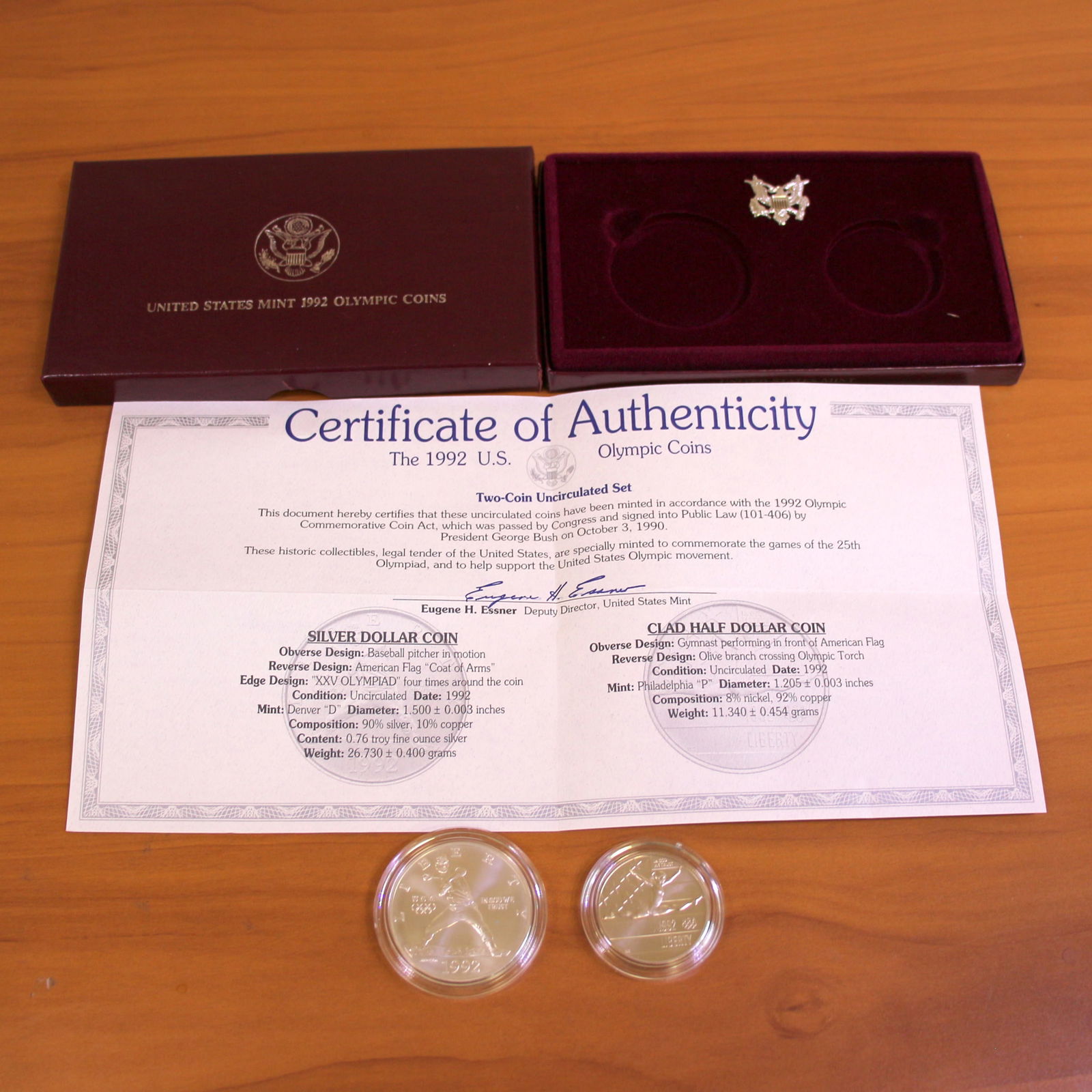 US Mint Olympic Uncirculated Coin Set OGP: Contains one 1992 90% Silver Uncirculated United States Olympic Silver Dollar. Also contains one 1992 Uncirculated United States Olympic Clad Half Dollar. Set in original government packaging and cont