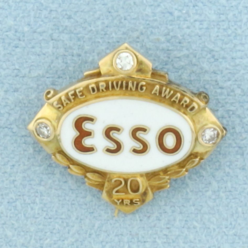 Vintage Esso Diamond Safe Driving 20 Years Pin in 10k Yellow Gold: In 10k Yellow Gold. Contains three high quality .01ct diamonds. Enamel detailing. 5/8 inch long. 5/8 inch wide. 2.3g.