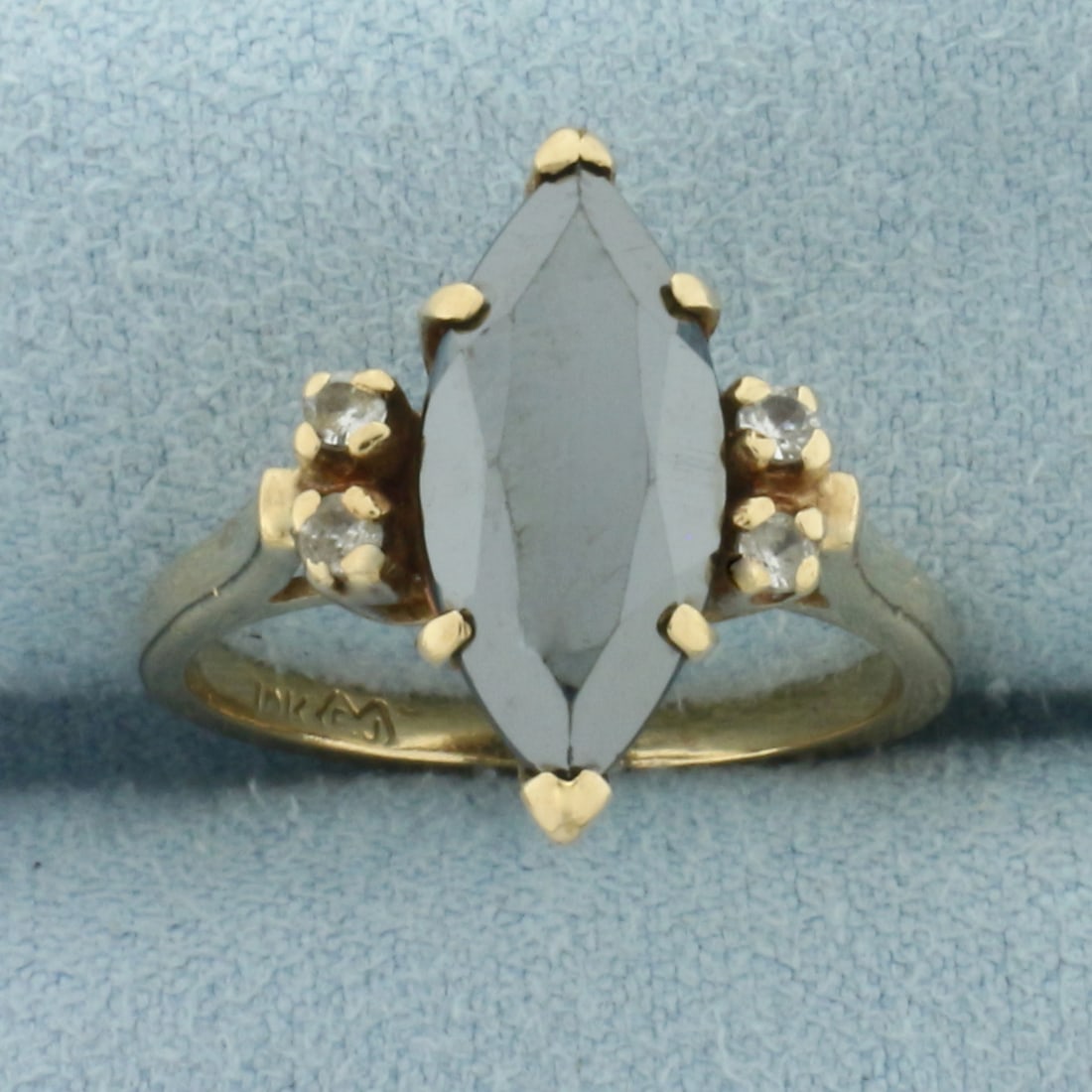 Vintage Hematite and White Sapphire Ring in 10k Yellow Gold: In 10k Yellow Gold. Contains one 16mm high quality Hematite gemstone. Also contains four high quality 2mm white Sapphire gemstones. Size 6.75. 3.8g.