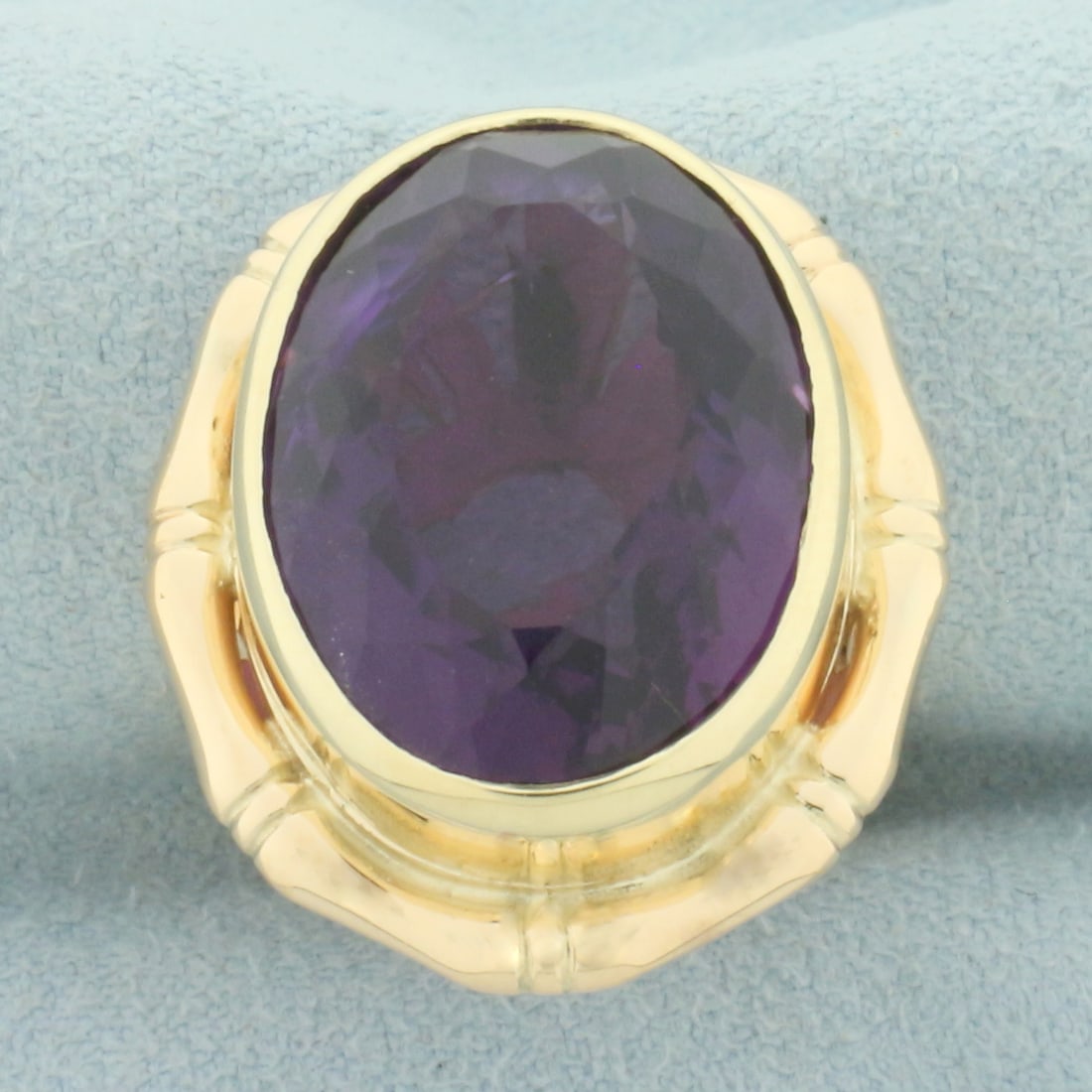 Amethyst Bamboo Design Statement Ring in 14k Yellow Gold: In 14k yellow gold. Contains 1 high quality natural 19x15mm oval faceted amethyst, approximately 16cts, with intense color and excellent clarity. Size: 6.5. 14.5g.