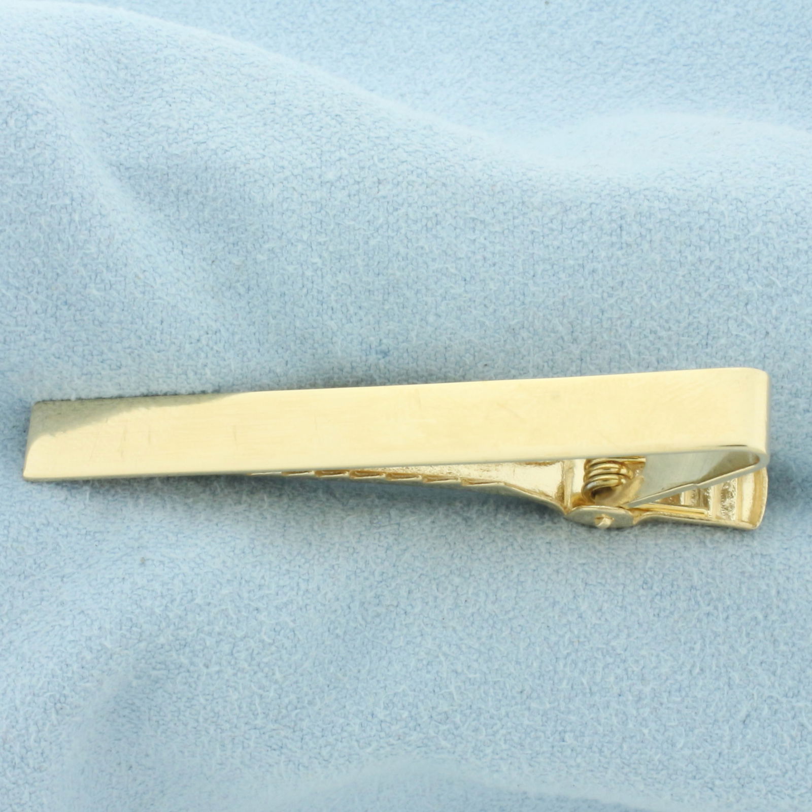 Engravable Tie Bar Clip in 14k Yellow Gold: In 14k yellow gold. 1 7/8 inches long and 6mm wide. Engravable. 5.1g.