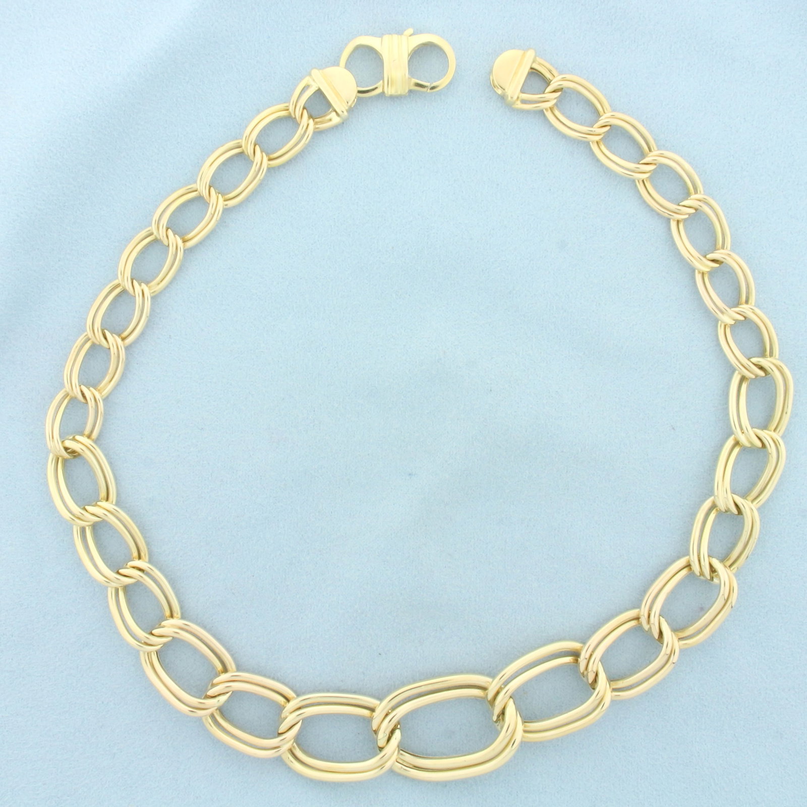 Graduated 16 Inch Double Oval Link Chain Necklace in 14k Yellow Gold: In 14k yellow gold. Italian made. 16 1/4 inches long and 21mm wide at widest (tapers to 12mm). Lobster clasp. 34.4g.