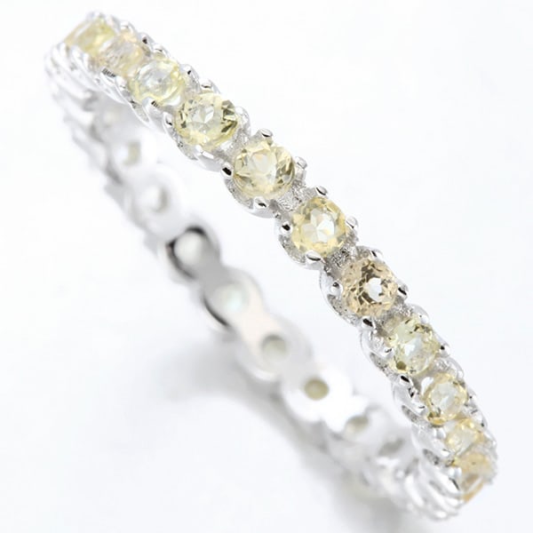 Citrine Eternity Stacking Band Ring in Sterling Silver: In platinum over .925 sterling silver. Contains 24 genuine citrine gemstones with light yellow color, 0.8ctw. Size 7. 1.6g