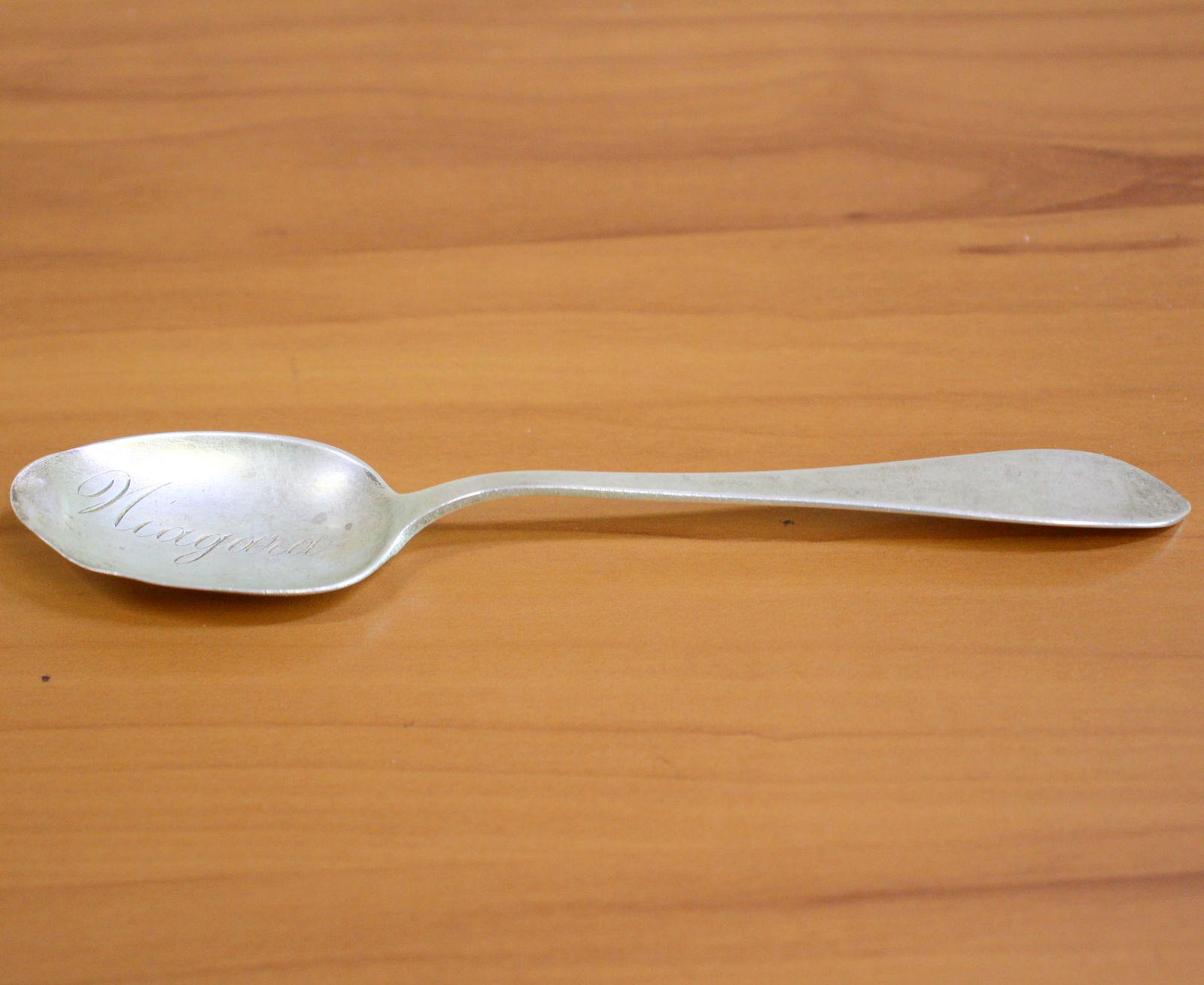 Antique TC Tanke Whiting "Colonial" Niagara Souvenir Sterling Silver Spoon: In .925 Sterling Silver. Contains one spoon. 6"8". Antique hand engraving "Niagara". Dented bowl. Original sold from TC Tank Jewelers in New York. 25.6g.