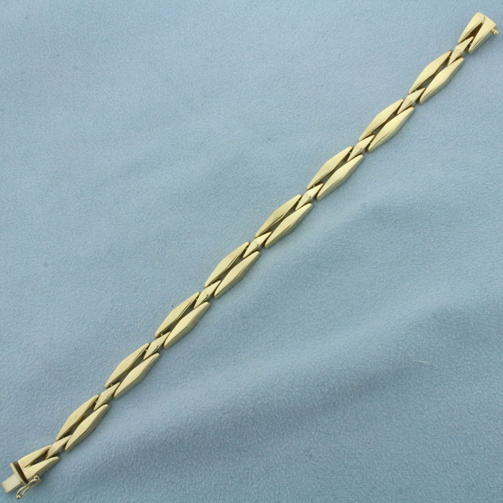 Italian Designer Elongated Diamond Link Bracelet in 14k Yellow Gold: In 14k Yellow Gold. 7 1/4 inches long. 7.6mm wide. Italian made. Concealed slide clasp with safety latch. 13.1g.