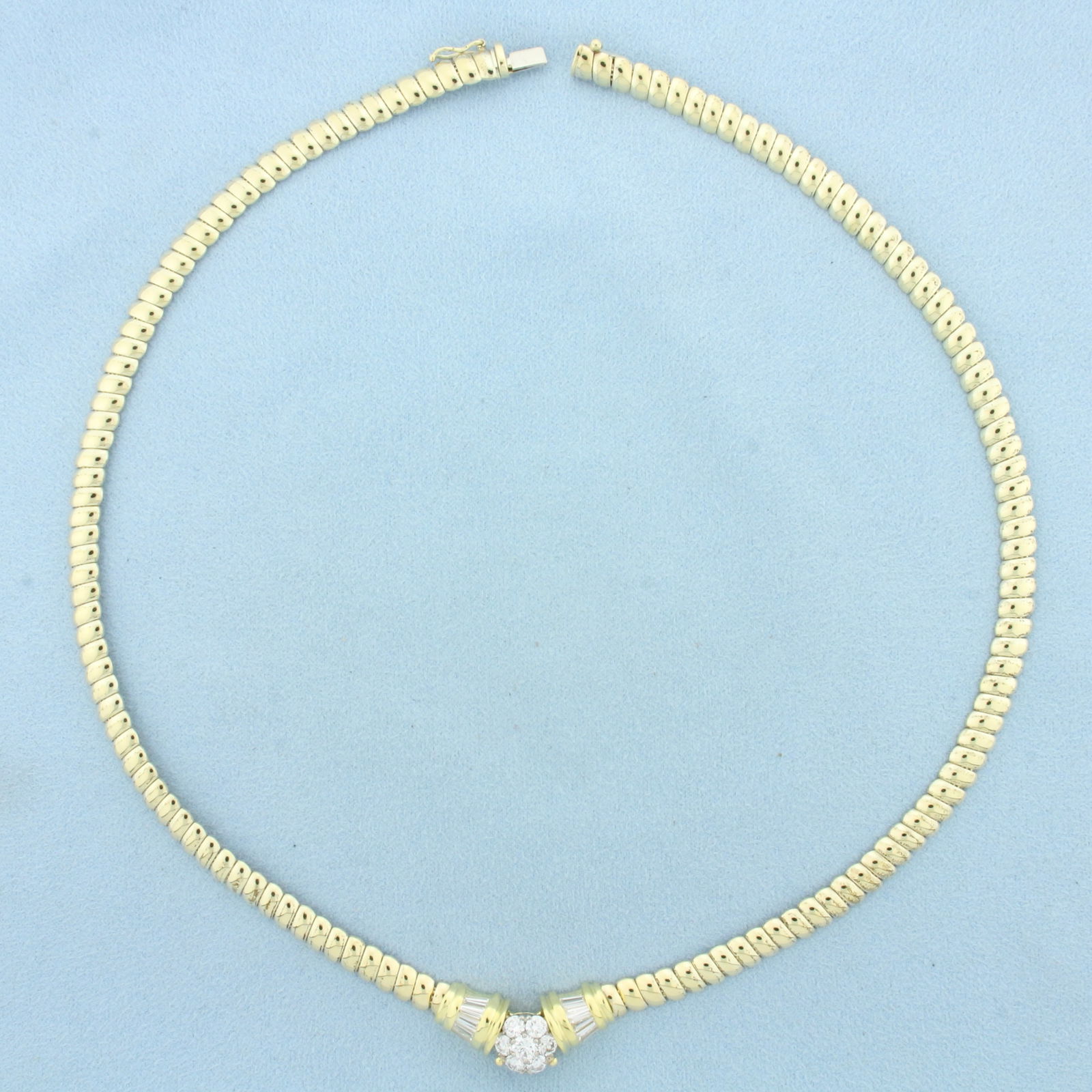 Italian Round and Baguette Diamond Designer Necklace in 14k Yellow Gold: In 14k Yellow Gold. Contains one .2ct and six .15ct high quality round brilliant diamonds, VS clarity/F color. Also contains ten 4mm baguette diamonds of similar high quality. 18 inches long. 5.5mm wi