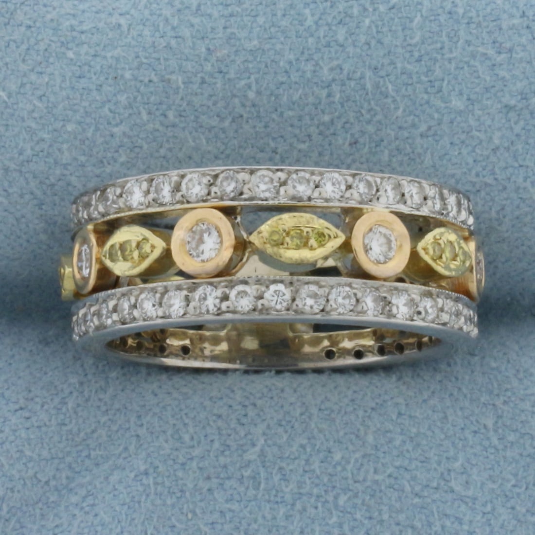 Wide Yellow and White Diamond Pave Band Ring in 18k White, Rose, and Yellow Gold: In 18k White, Rose, and Yellow Gold. Contains six .06ct and sixty-two .02ct high quality diamonds, VS clarity/G color. Also contains twenty-one 1/2pt fancy yellow high quality diamonds. 8.2mm wide. Si