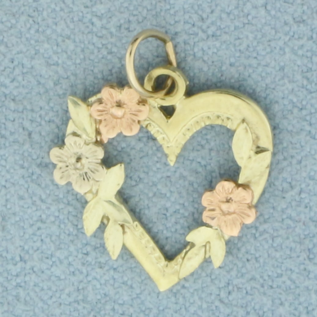 Tri-Color Heart Flower Pendant or Charm in 14k Yellow, Rose, and White Gold: In 14k Yellow, Rose, and White Gold. 3/4 inch long including jump ring. 5/8 inch wide. 1.2g.