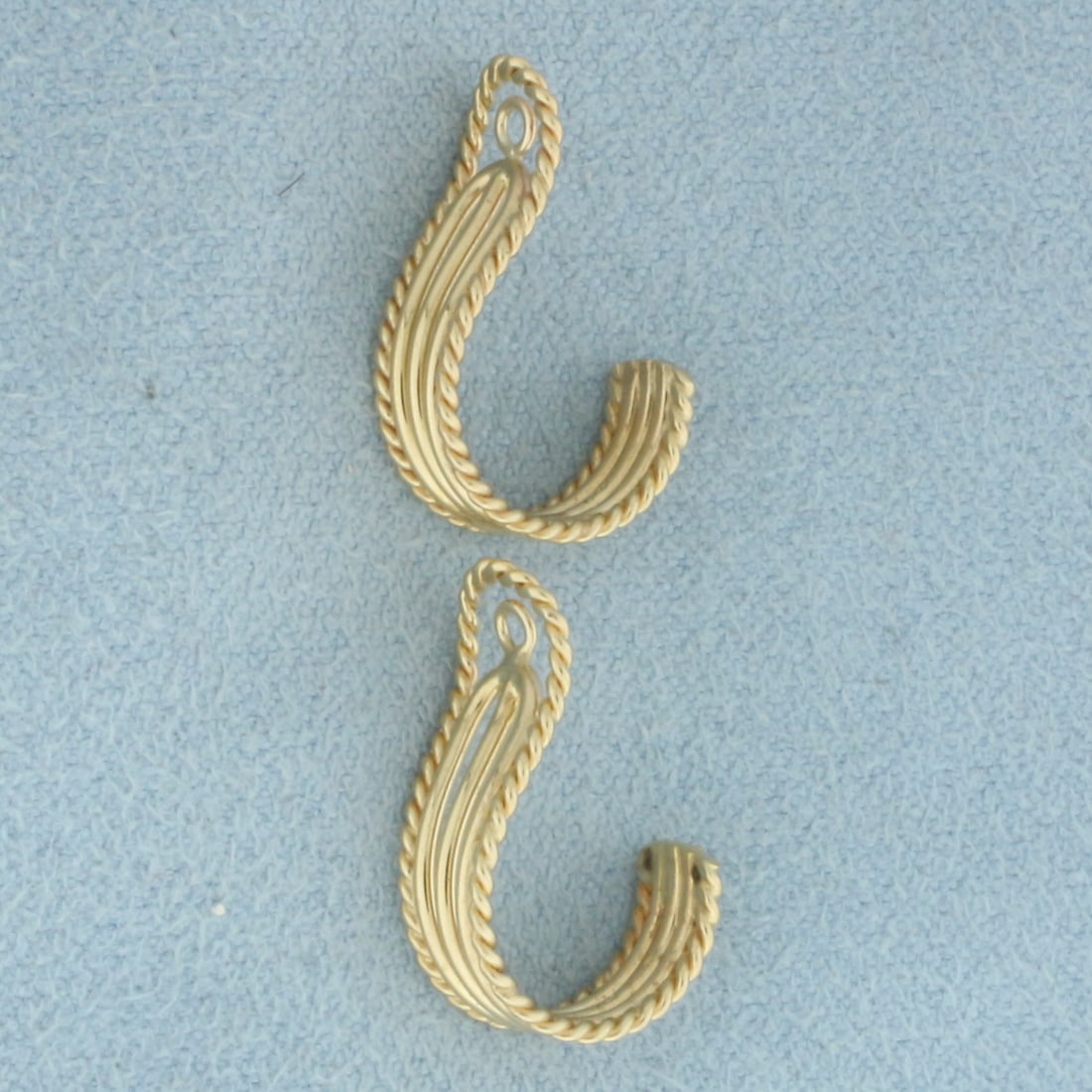 J-Hoop Rope Design Stud Earring Jacket Enhancers in 14k Yellow Gold: In 14k Yellow Gold. 3/4 inch long. 1/4 inch wide. Made to fit around stud earrings to give a fresh new look. 2.4g.
