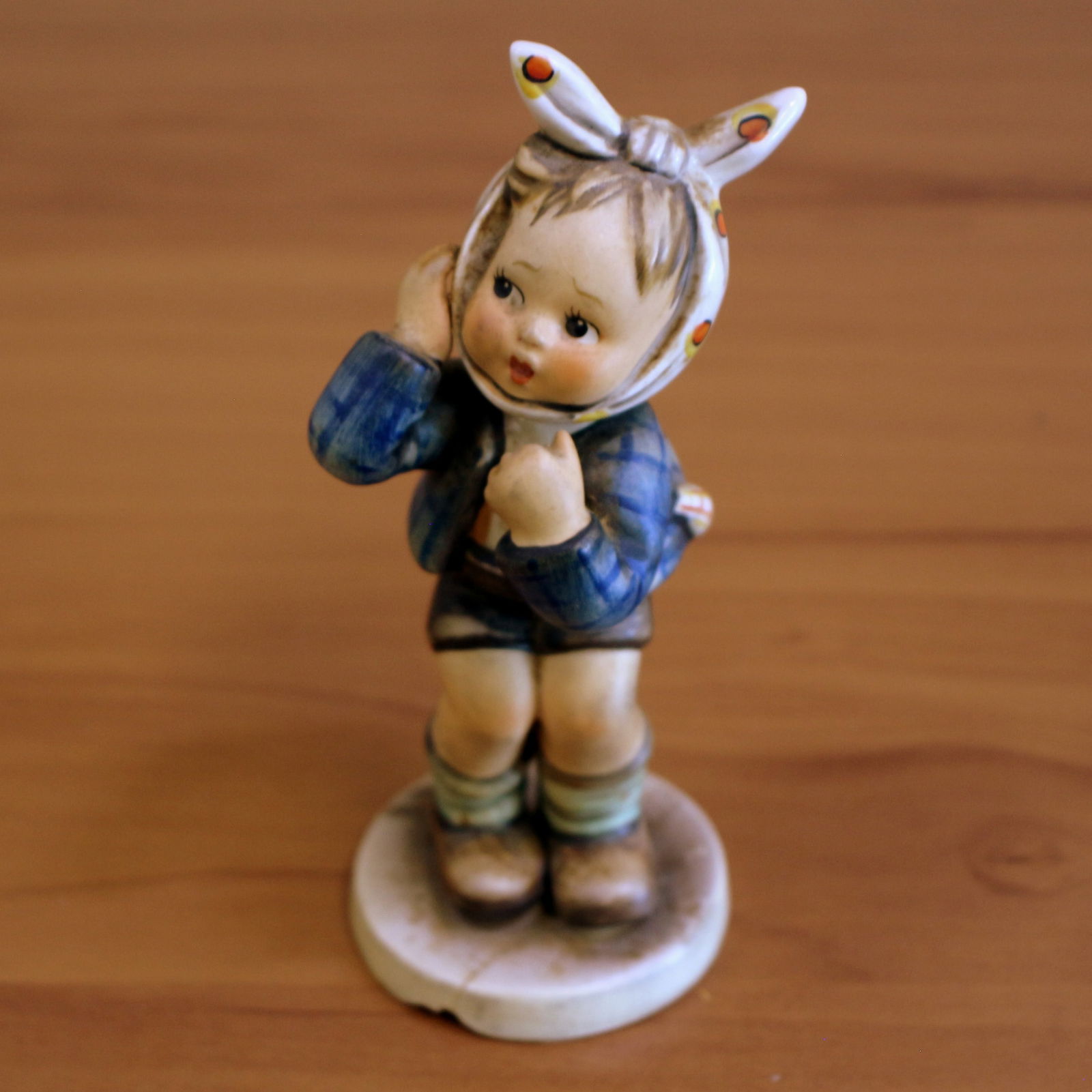 Goebel "Boy with Toothache" Hummel Figurine: 5 1/2 inches tall. 2 1/2 inches wide. Model #217. Chip in figurine bottom.