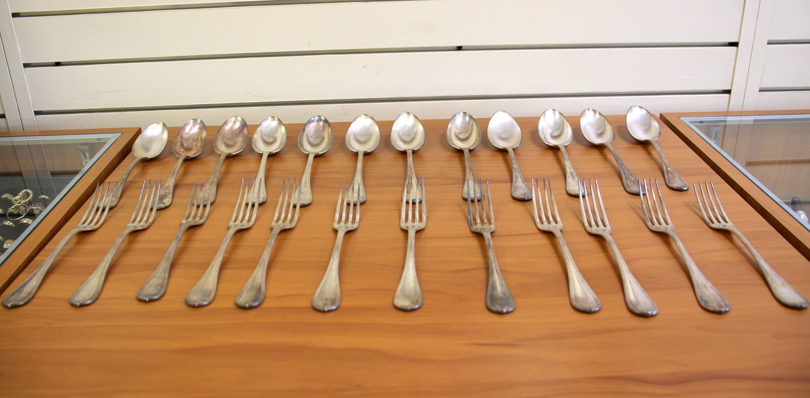 Christofle Rubans Silverplate Flatware Set: Silverplate, old marks early 20th century. Twenty four pieces total. Twelve forks 8.5 inches. Twelve European Place/oval soup spoons 8.5 inches. This is a rare set of larger pieces with a faint hand e
