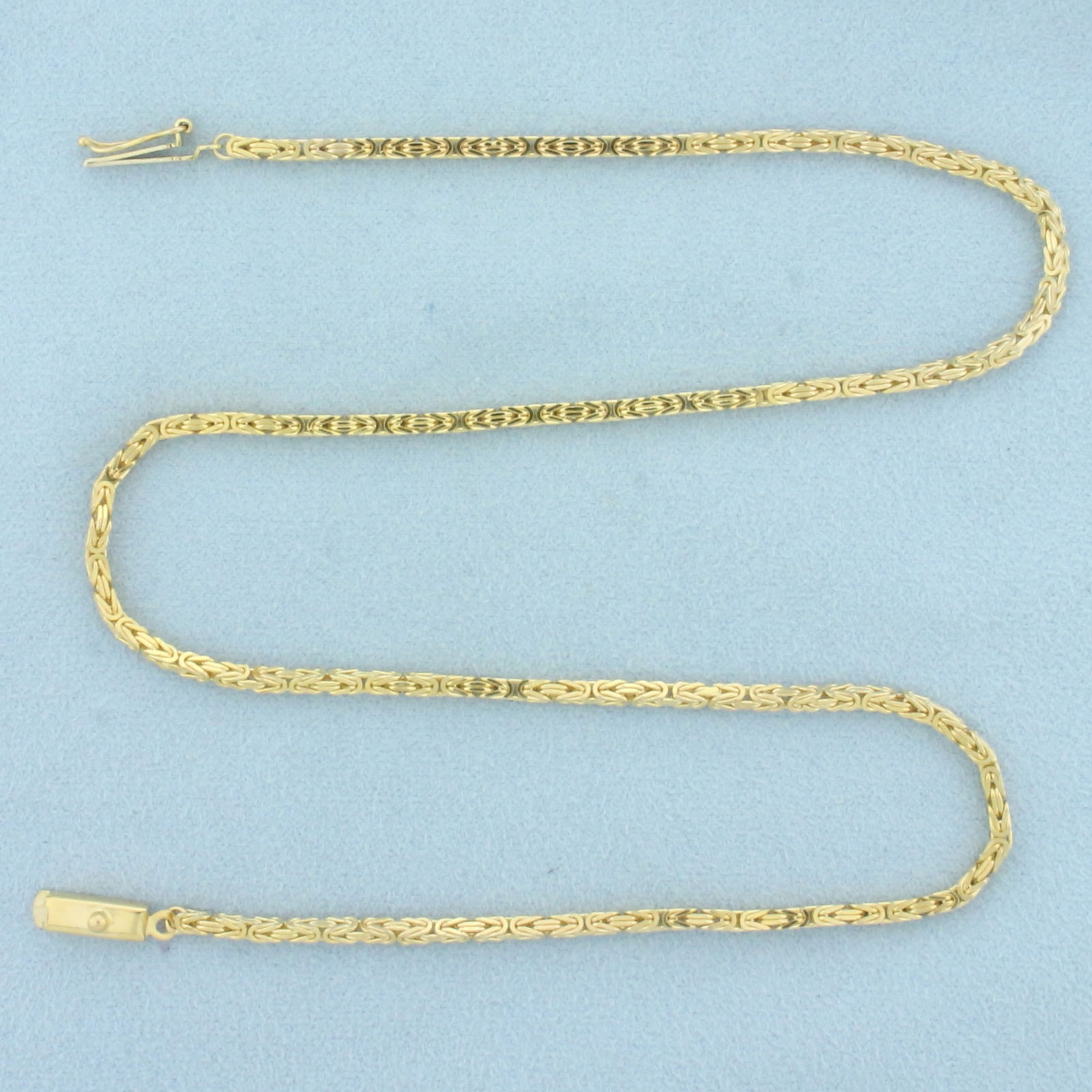 Italian Squared Byzantine Link Chain Necklace in 14k Yellow Gold: In 14k yellow gold. Italian made. 15 1/2 inches long and 2mm thick. Slide clasp with safety latch. 11.8g.