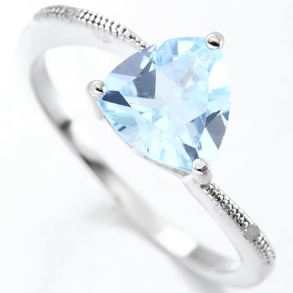 Blue Topaz and Diamond Ring in Sterling Silver: In platinum over .925 sterling silver. Contains one blue topaz gemstone, 2cts, accented with two genuine diamonds, .01ctw. Size 7. 2.2g