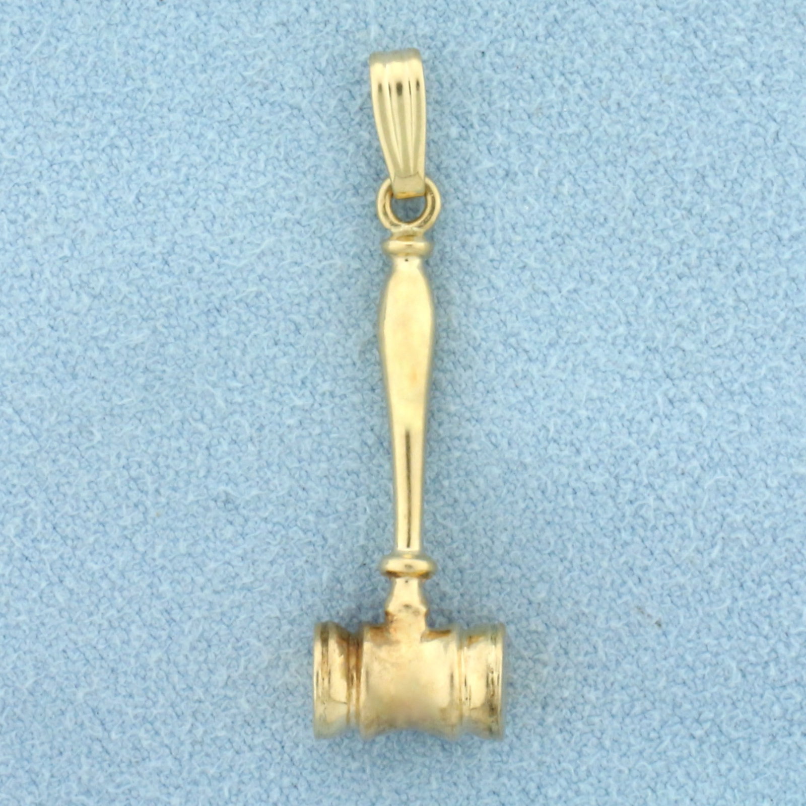Gavel Pendant in 14k Yellow Gold: In 14k Yellow Gold. 1 1/4 inch long, 3/8 inch wide. 2.5g.