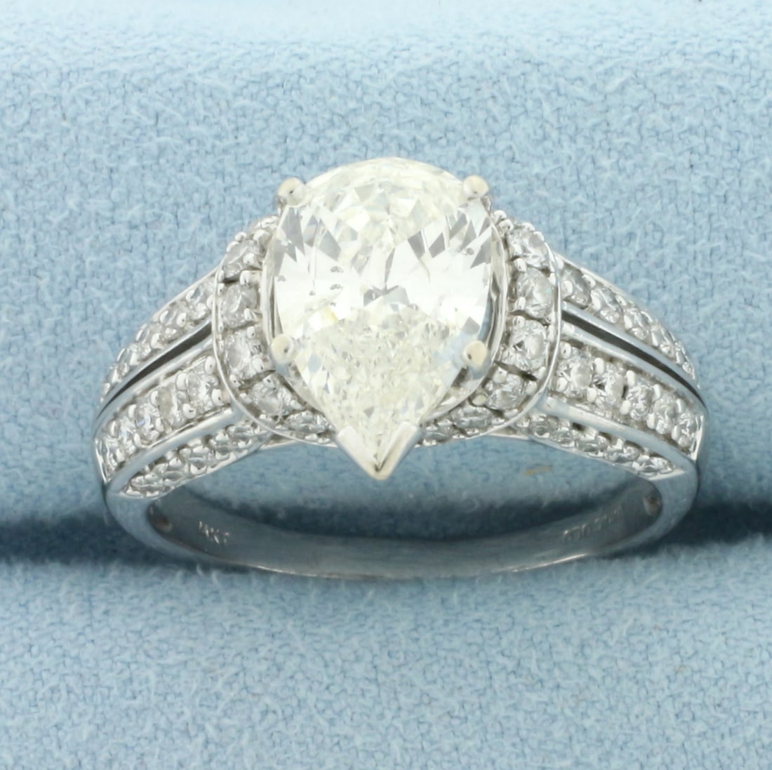 Vintage Pear Diamond Engagement Ring in 14k White Gold: In 14k White Gold. Contains one high quality natural 12.5mm by 8mm pear shaped diamonds, 2.5ct, J color/I clarity. Also contains sixty high quality round diamonds, 3/4ct TW, of similar high quality. S