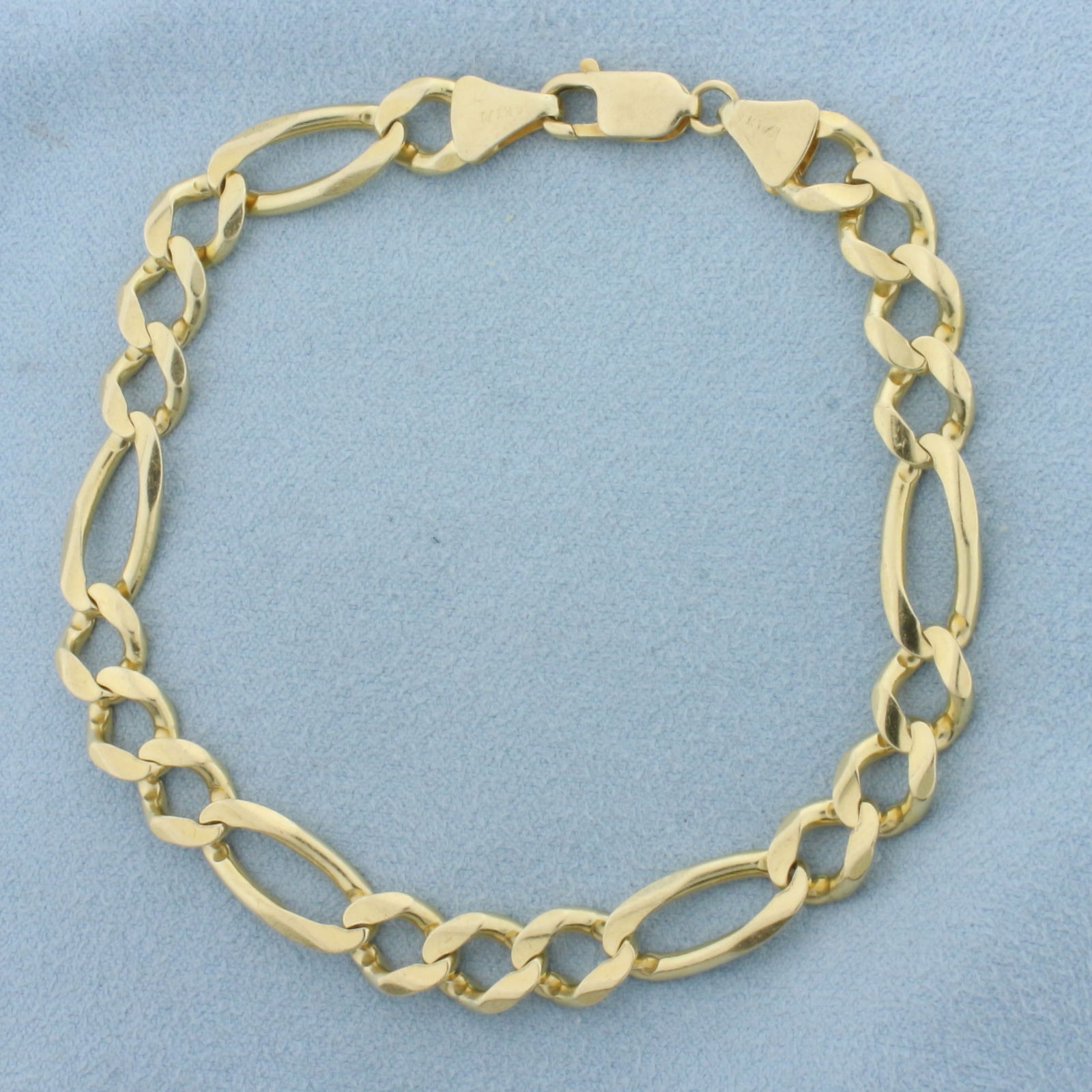 Italian Figaro Link Bracelet in 14k Yellow Gold: In 14k Yellow Gold. 8 3/4 inch long. 8mm wide. Italian made. Lobster clasp. 18.4g.
