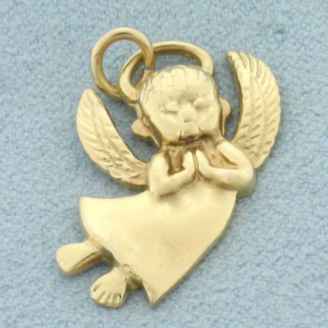 Angel Pendant in 14k Yellow Gold: In 14k Yellow Gold. 1 inch long including bale. 3/4 inch wide. 3.0g.