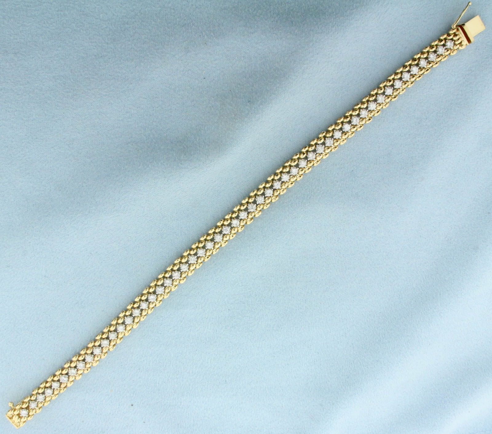 Diamond Panther Link Tennis Bracelet in 14k Yellow Gold: In 14k Yellow Gold. Contains fifty-two high quality diamonds, 2ct TW, SI clarity/H color. 8 inches long. 1/4 inch wide. Slide closure with safety latch. 19.1g.