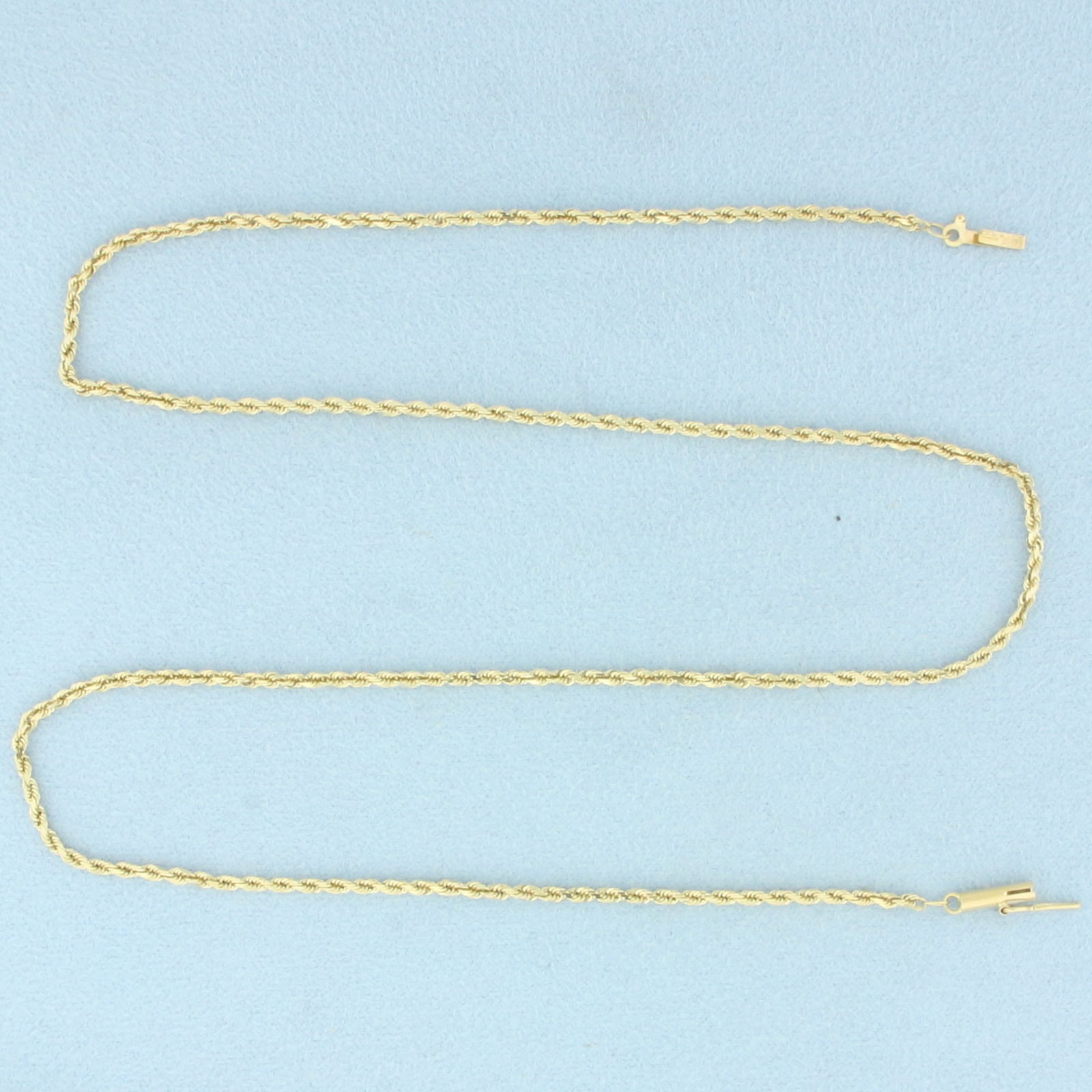 18 Inch Rope Link Chain Necklace in 14k Yellow Gold: In 14k Yellow Gold. 18 inches long. 1.8mm wide. Barrel clasp with safety latch. 5.1g.