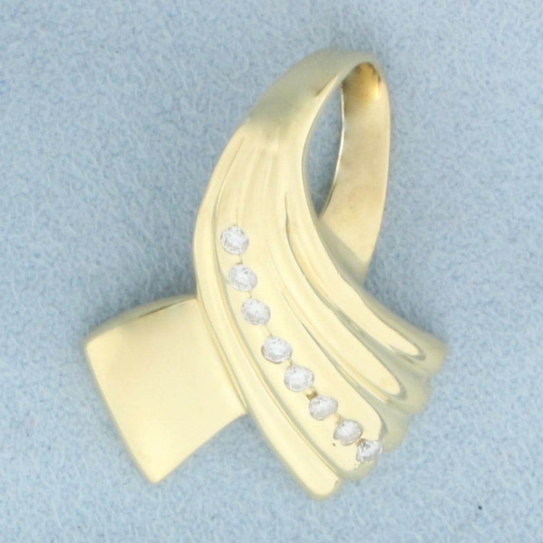 Diamond Ribbon Enhancer or Slide or Pendant in 14k Yellow Gold: In 14k Yellow Gold. Contains eight high quality diamonds, 1/5ct TW, VS clarity/G color. 1 1/8 inch long. 7/8 inch wide. 5.7g.