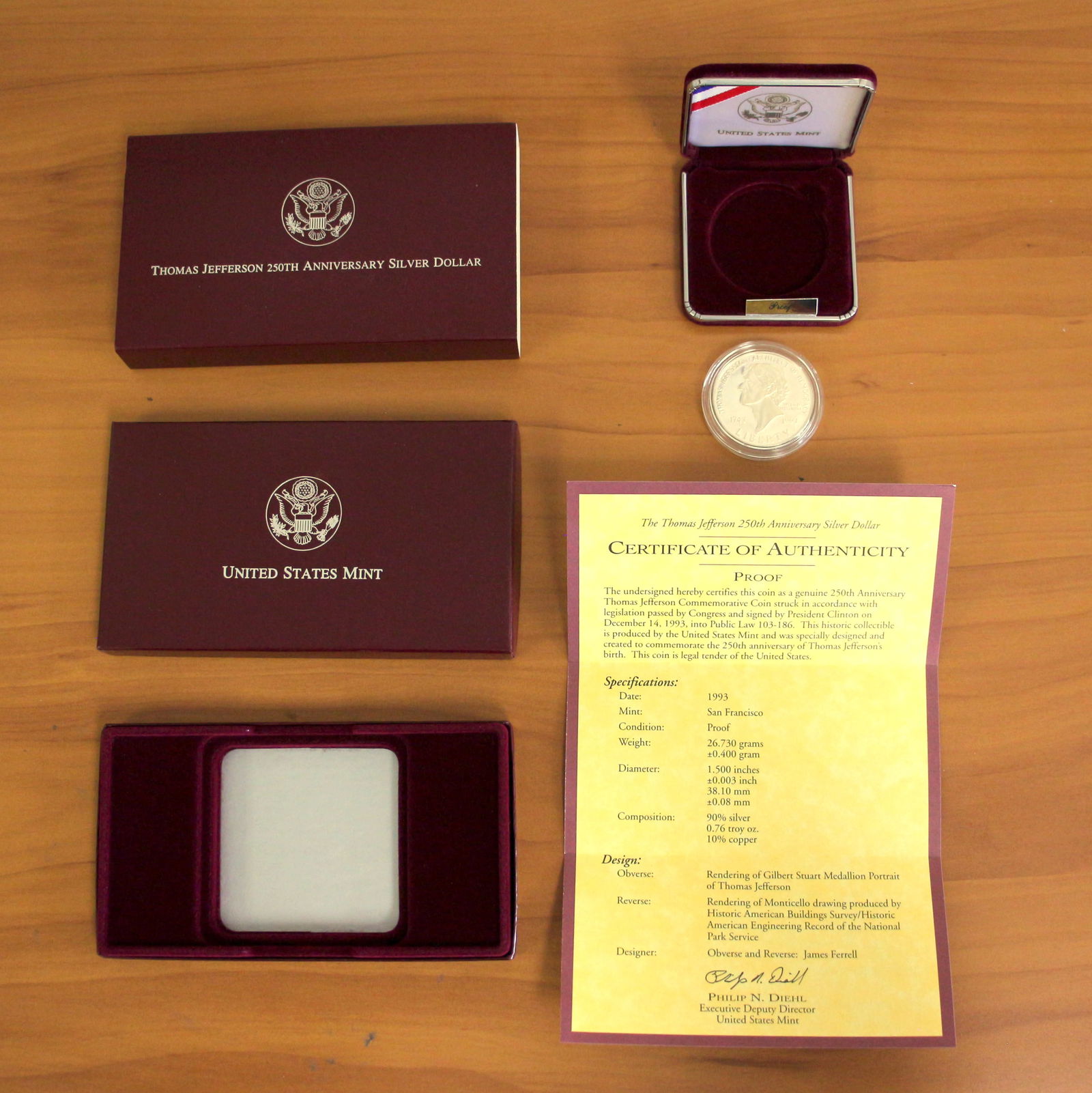 US Mint Thomas Jefferson 250th Anniversary Silver Dollar Poof Coin OGP: Contains one 1993 U.S. Mint Thomas Jefferson 250th Anniversary 90% Silver Dollar. Includes CoA, original box and packaging.