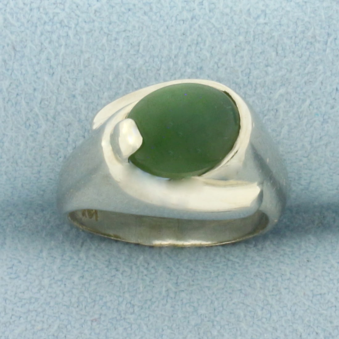 Jade Solitaire Ring in 14k White Gold: In 14k White Gold. Contains one 9x7mm high quality natural Jade gemstone with beautiful green color. Size 4.5. 4.6g.