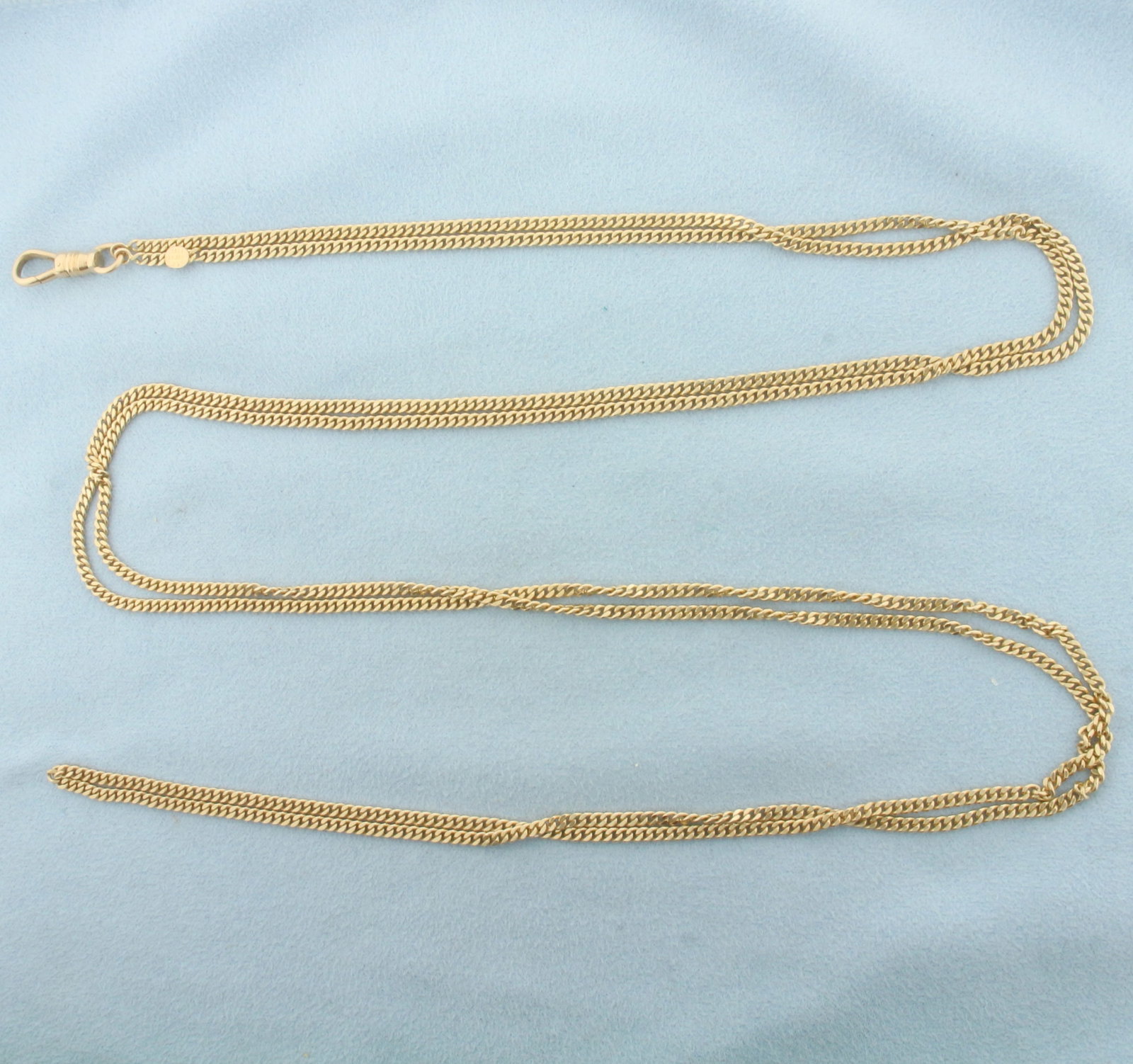 Antique 1917 Curb Link Pocket Watch Chain with Dog Clip in 14k Yellow Gold: In 14k Yellow Gold. 29 inches long. 2.4mm wide chain. Made by Peikes (Freed and Peikes from New York). 29.6g.