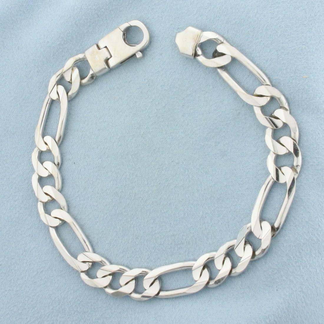 Mens Heavy Figaro Link Bracelet in 14k White Gold: In 14k White Gold. 9 1/8 inches long. 10mm wide. Lobster clasp. Solid links. 37.4g.