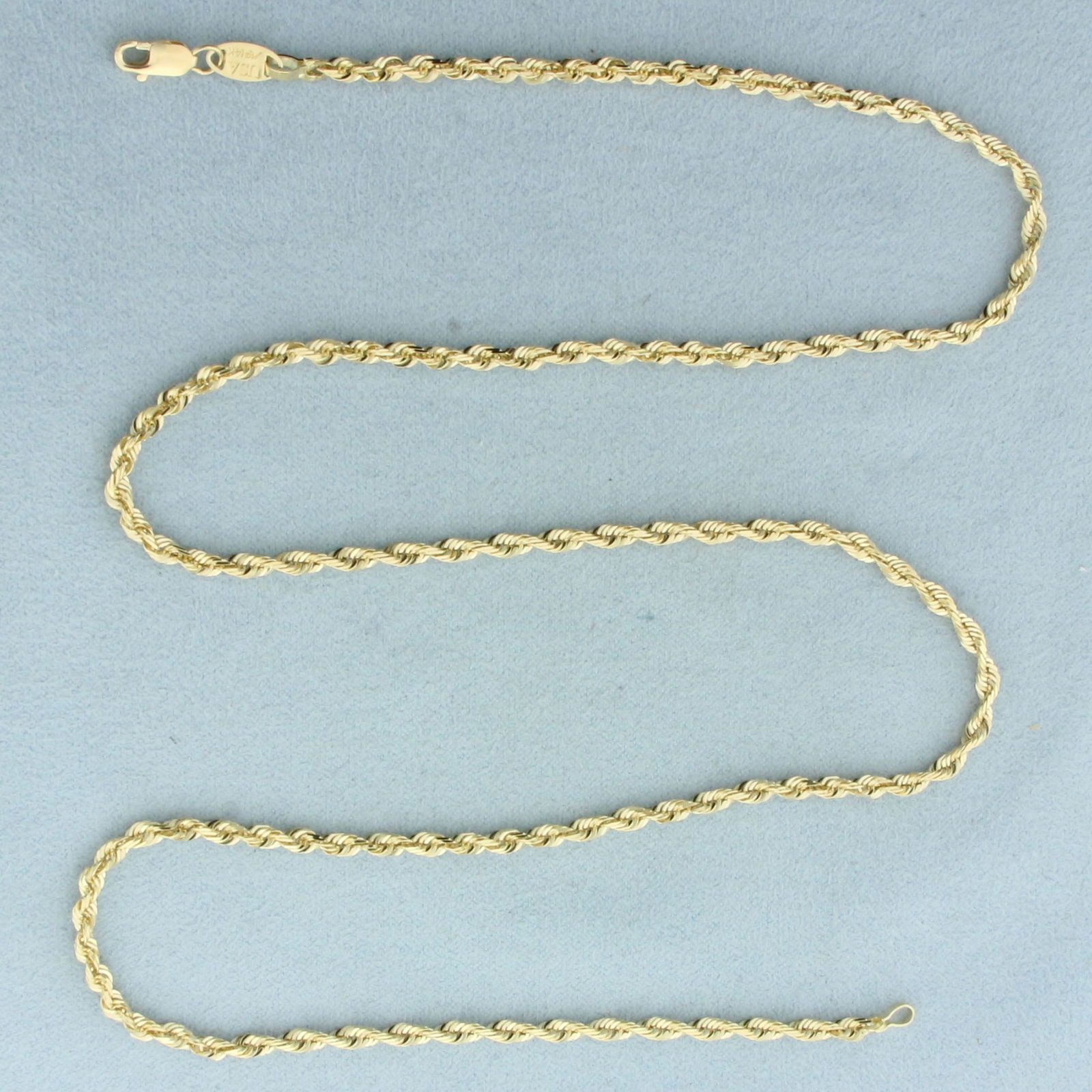 22 Inch Rope Link Chain Necklace in 14k Yellow Gold: In 14k Yellow Gold. 22 inches long. 2.6mm wide. Lobster clasp. 11.2g.