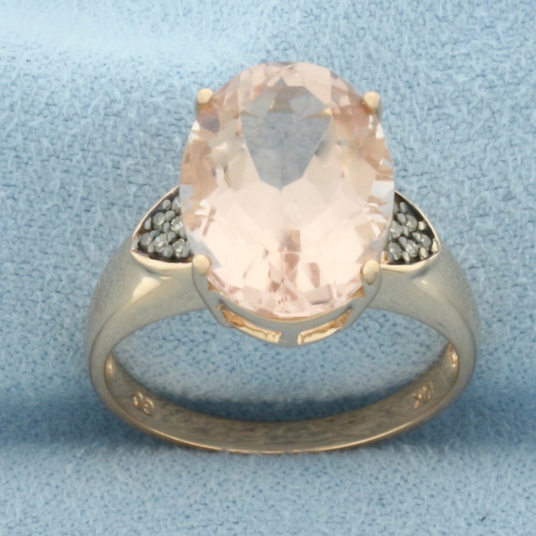 Morganite & Diamond Ring in 10k Rose Gold: In 10k rose gold. Contains one high quality 14x10mm Morganite gemstones, approximately 5ct, with bright salmon color and excellent clarity. Also contains 12 high quality 1/2pt diamonds. Size 7. 3.7g.