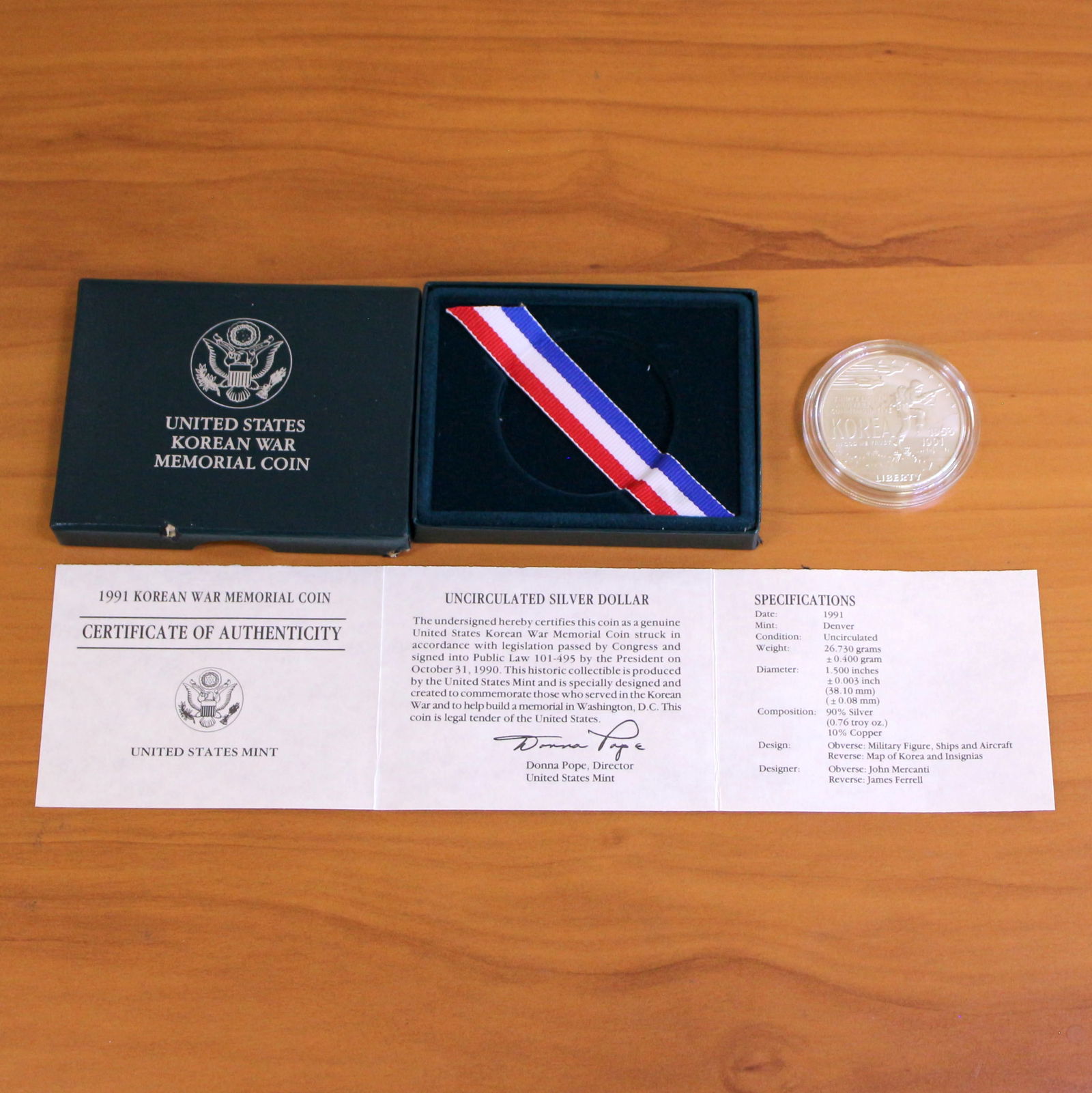 US Mint Korean War Memorial Silver Dollar Proof Coin OGP: Contains one 1991 United States Mint 90% Silver Commemorative Silver Dollar. Set in original packaging and contains certificate of authenticity.