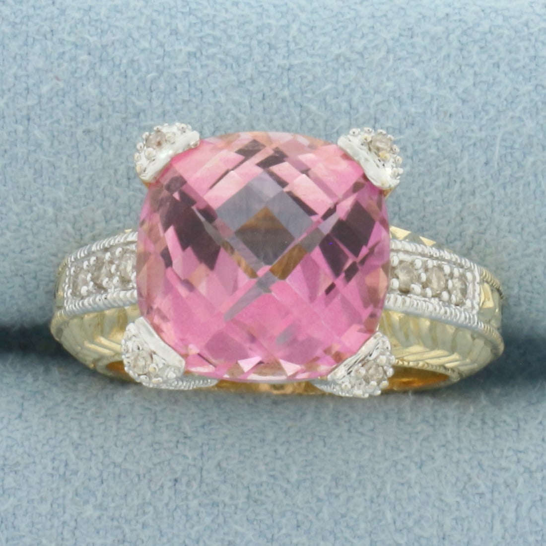 Checkerboard Pink Topaz and Diamond Ring in 14k Yellow Gold: In 14k Yellow Gold with 14k White Gold Accents. Contains one 12x12mm high quality fancy checkerboard cushion cut natural Pink Topaz gemstone, approximately 10cts, with vibrant color and excellent clar