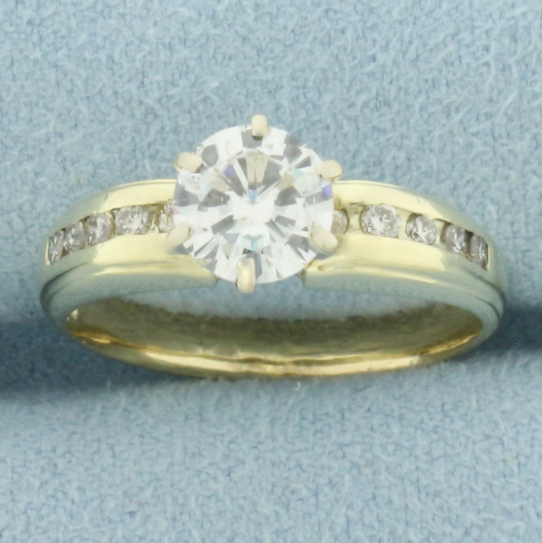 Diamond Engagement Ring in 14k Yellow Gold: In14k Yellow Gold. Contains one 1ct high quality round brilliant diamond, H color/I1 clarity, great cut for added brilliance, eye clean. Also contains ten high quality .01ct diamonds of similar high q