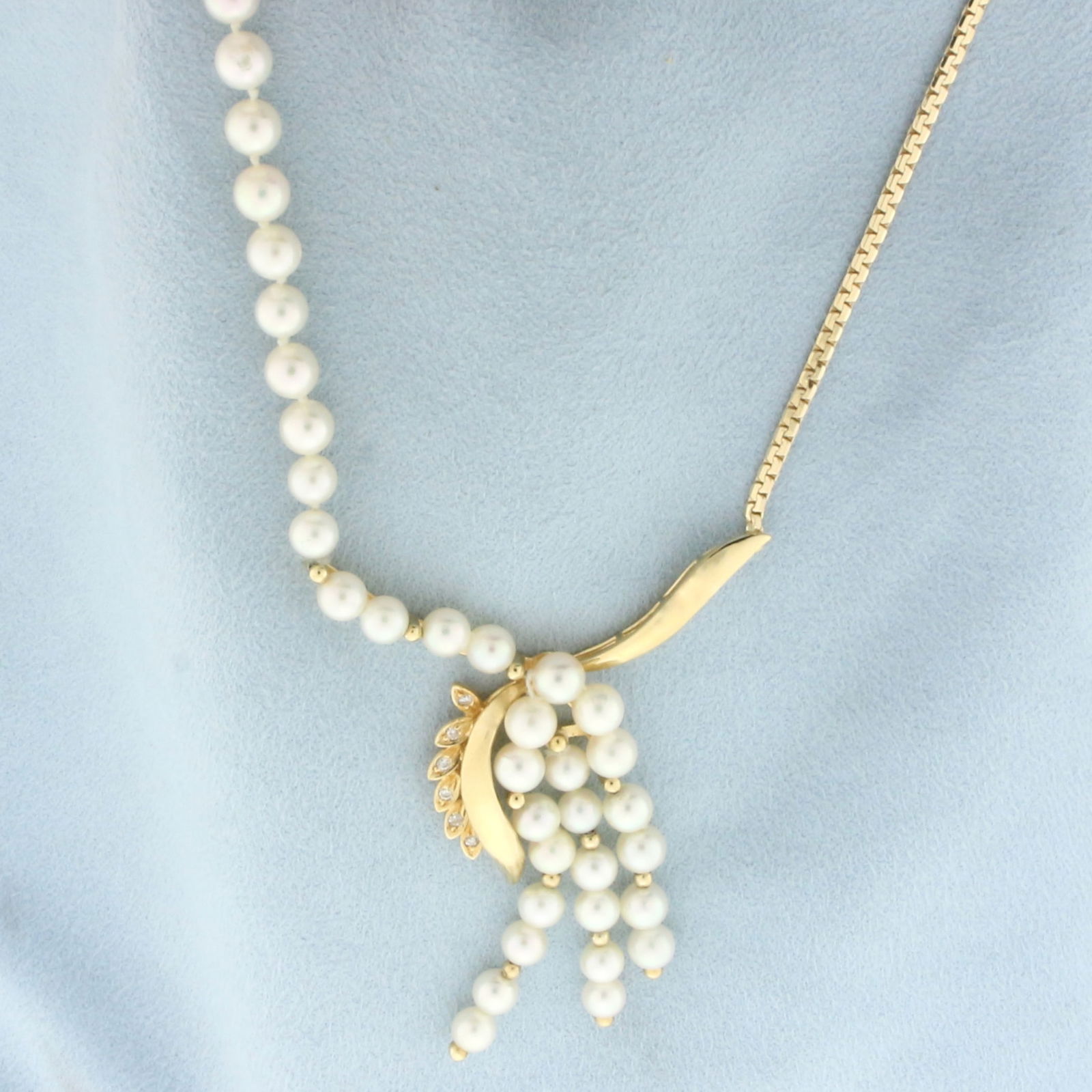 Designer Pearl and Diamond Necklace in 14k Yellow Gold: In 14k yellow gold. Contains 60 high quality cultured pearls ranging from 4.5mm to 5mm each with high luster. Also contains six high quality 1/2pt diamonds. 19 inches long. Fisook clasp. 15.5g.