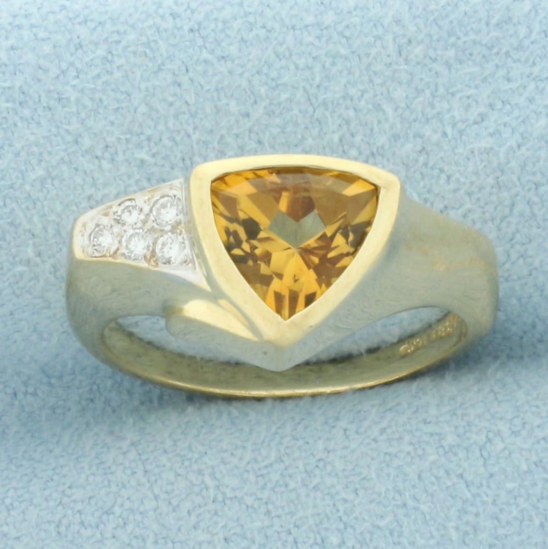 Bezel Trillion Citrine and Diamond Ring in 14k Yellow Gold: In 14k yellow gold. Contains one high quality natural 8mm Citrine gemstone with intense orange yellow color and excellent clarity. Also contains five high quality .01ct diamonds, VS clarity/G color. S