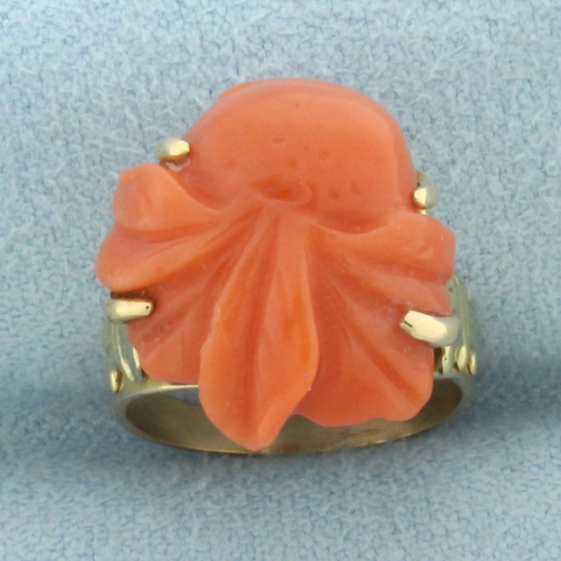 Antique Carved Red Coral Pinky Ring in 10k Rose Gold: In 10k rose gold. Contains one high quality 15mm hand carved red coral gemstone with intense color. 15.3mm wide at widest. Size: 2.25.