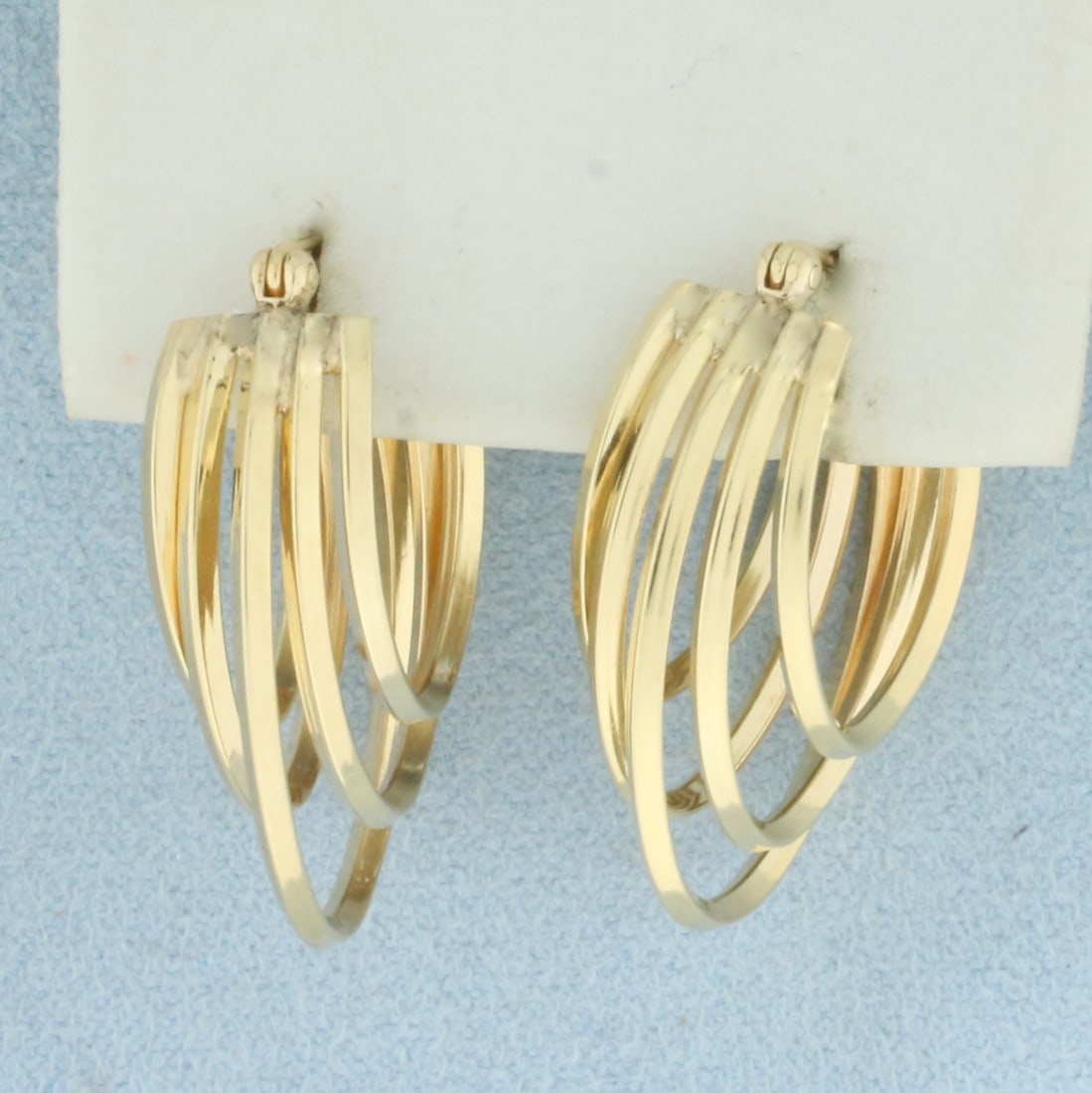 Designer 3D Oval Hoop Earrings in 14k Yellow Gold: In 14k Yellow Gold. 1 1/8 inch long. 3/4 inch wide at widest. 4.6g.