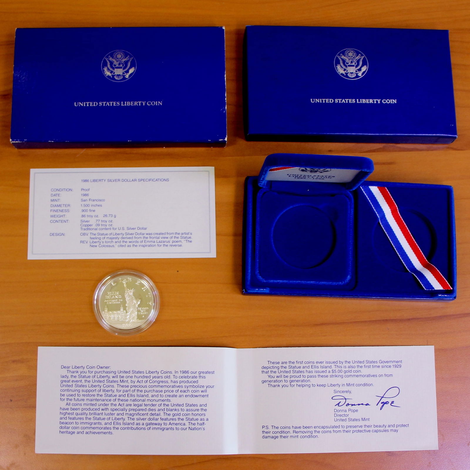 US Mint Liberty Silver Dollar Coin Proof Set OGP 1986: 1986 US Mint Liberty Coin Proof Set. Contains one coin - Silver Dollar. Includes CoA, government packaging, and box.